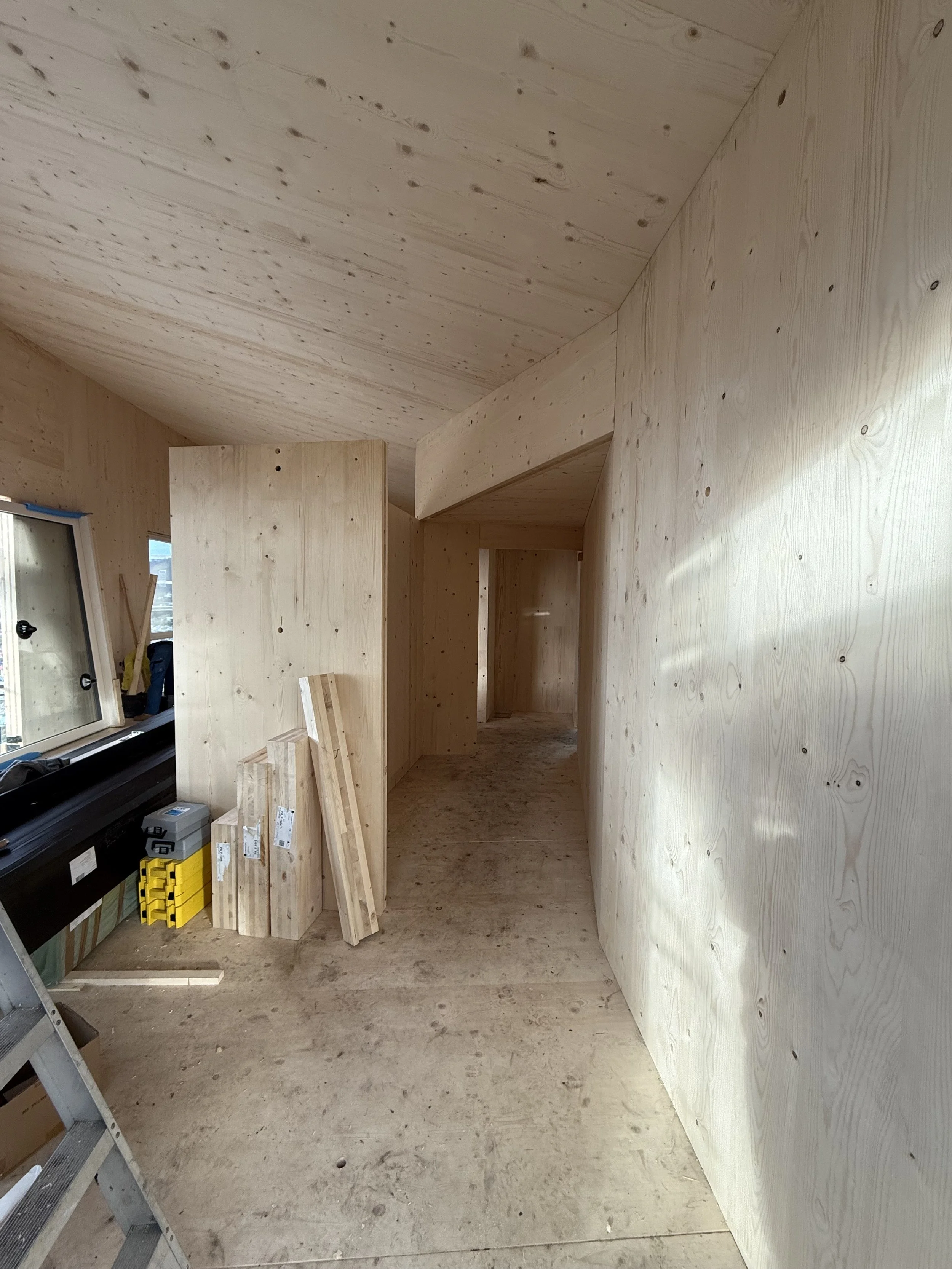Hobart Hills CLT House. Site construction progress showing CLT mass timber interior by Loubser Workshop
