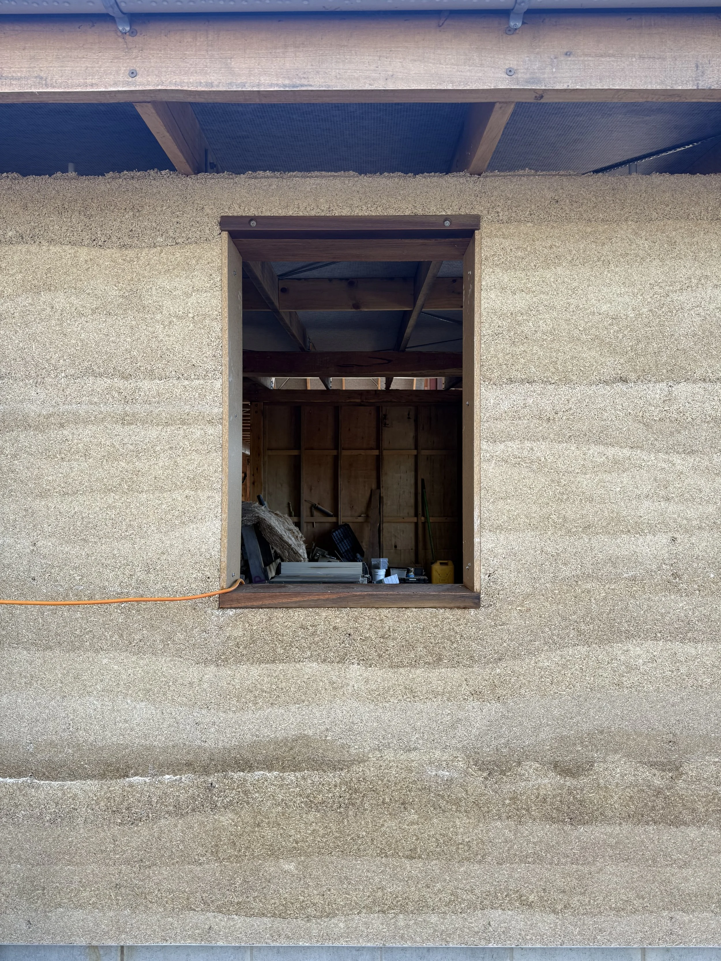 Bicheno Bushbuck. Construction progress and window opening in hempcrete wall