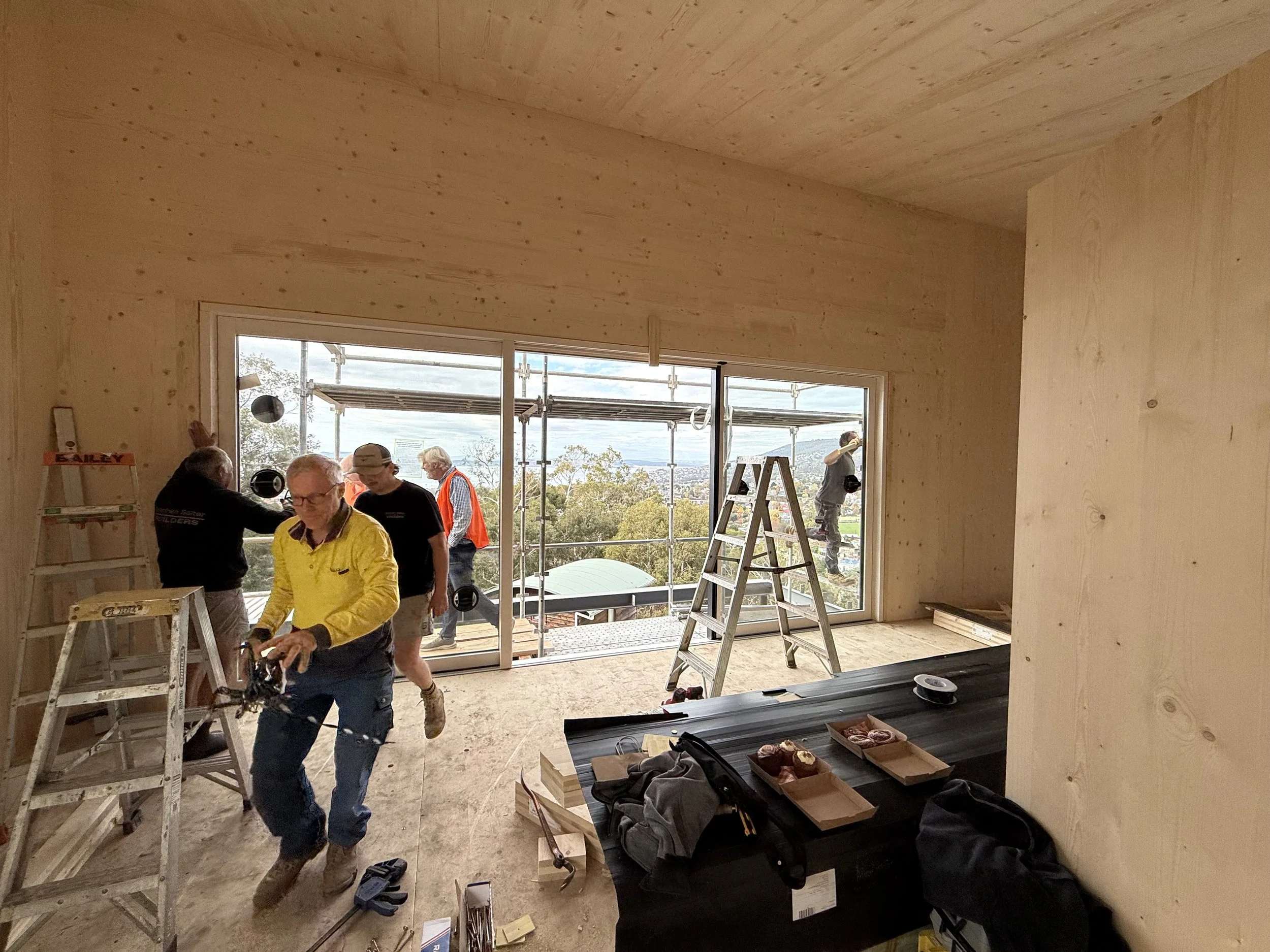 Hobart Hills CLT House. Site construction progress showing CLT mass timber and triple glazed door installation by Loubser Workshop