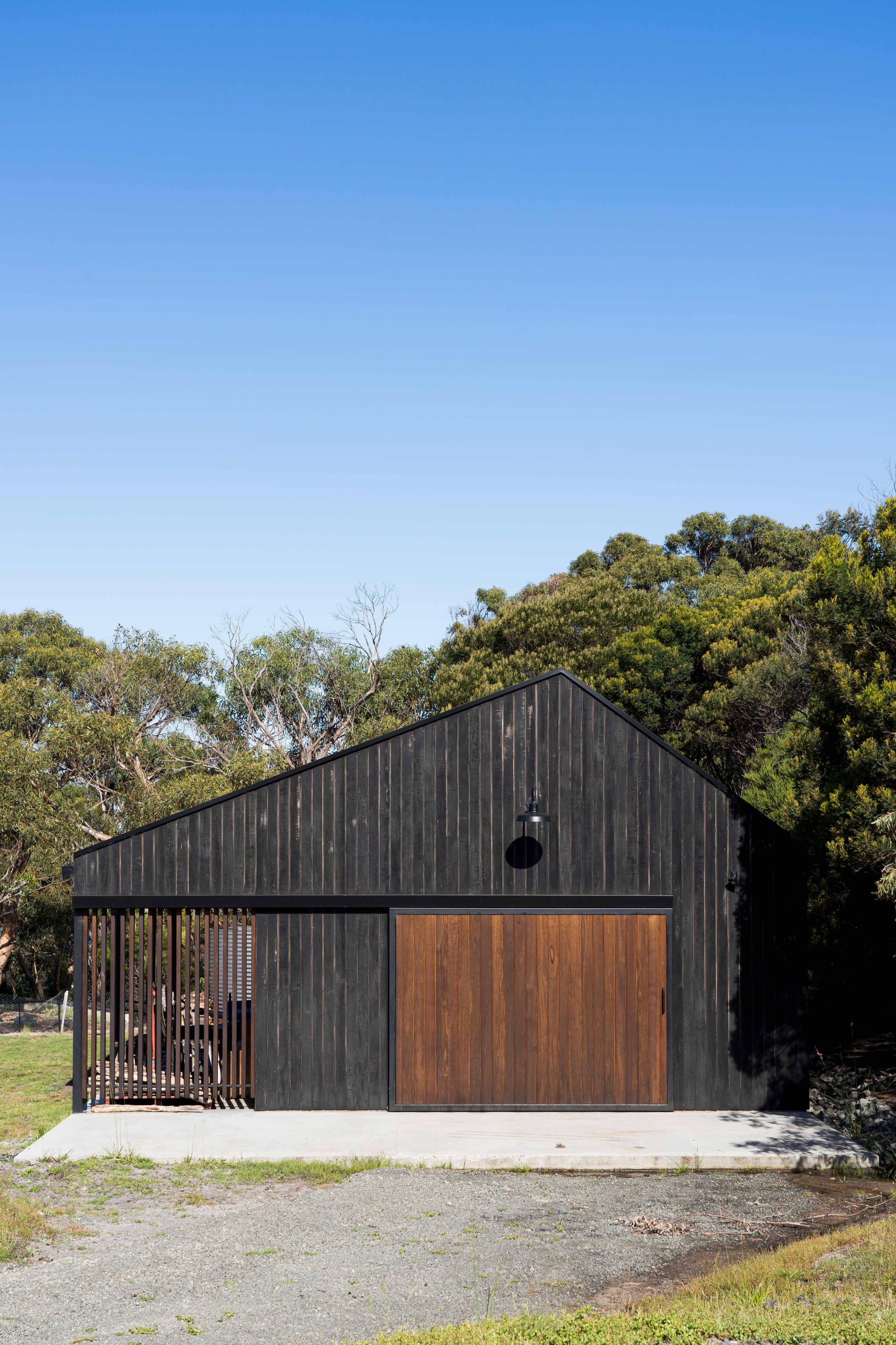 Rural dream home shed with Shou Sugi Ban cladding in Bicheno, Tasmania by Loubser Workshop