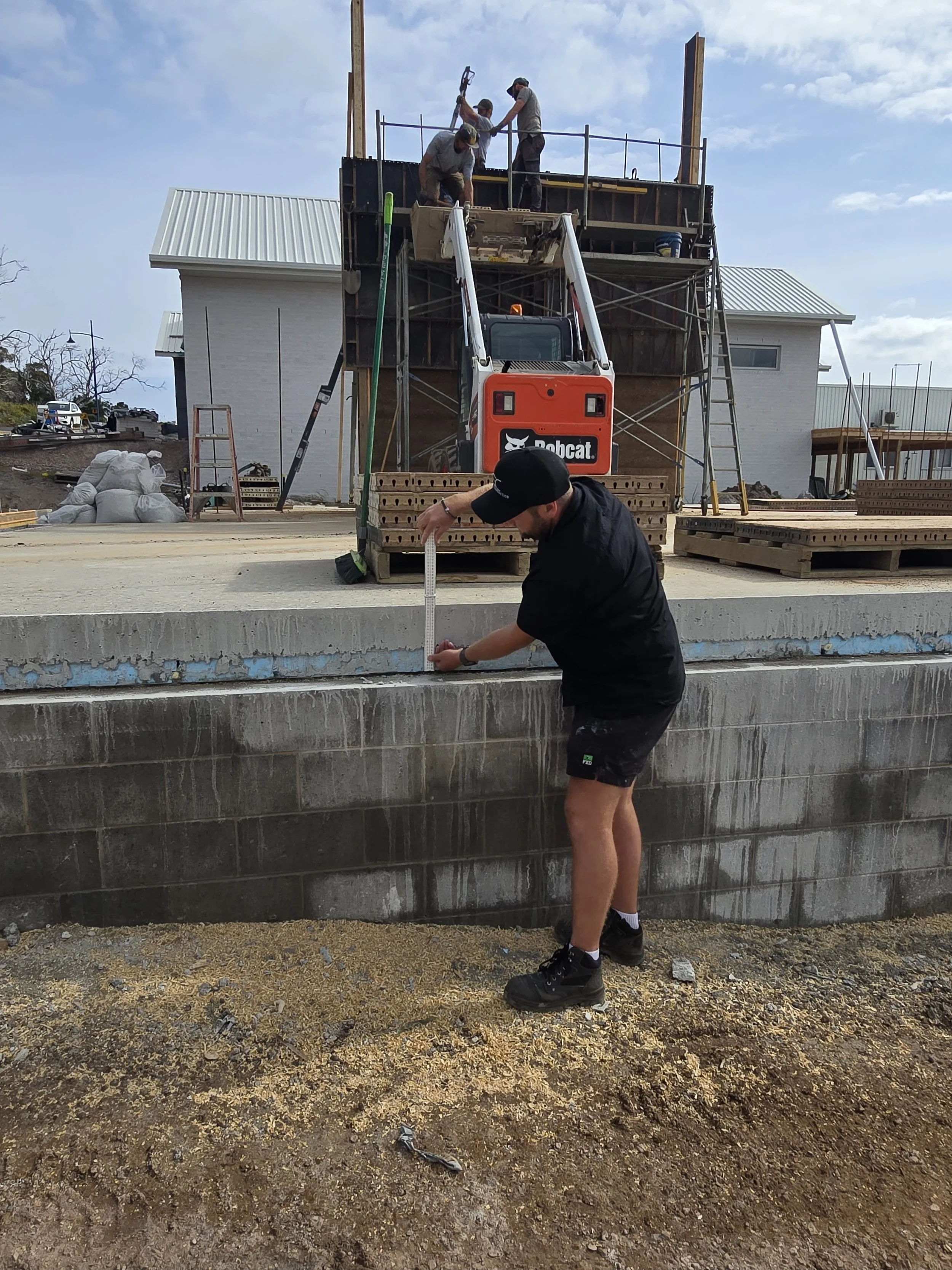Ocean View Passivhaus. Dan the builder confirming the as built insulation thickness