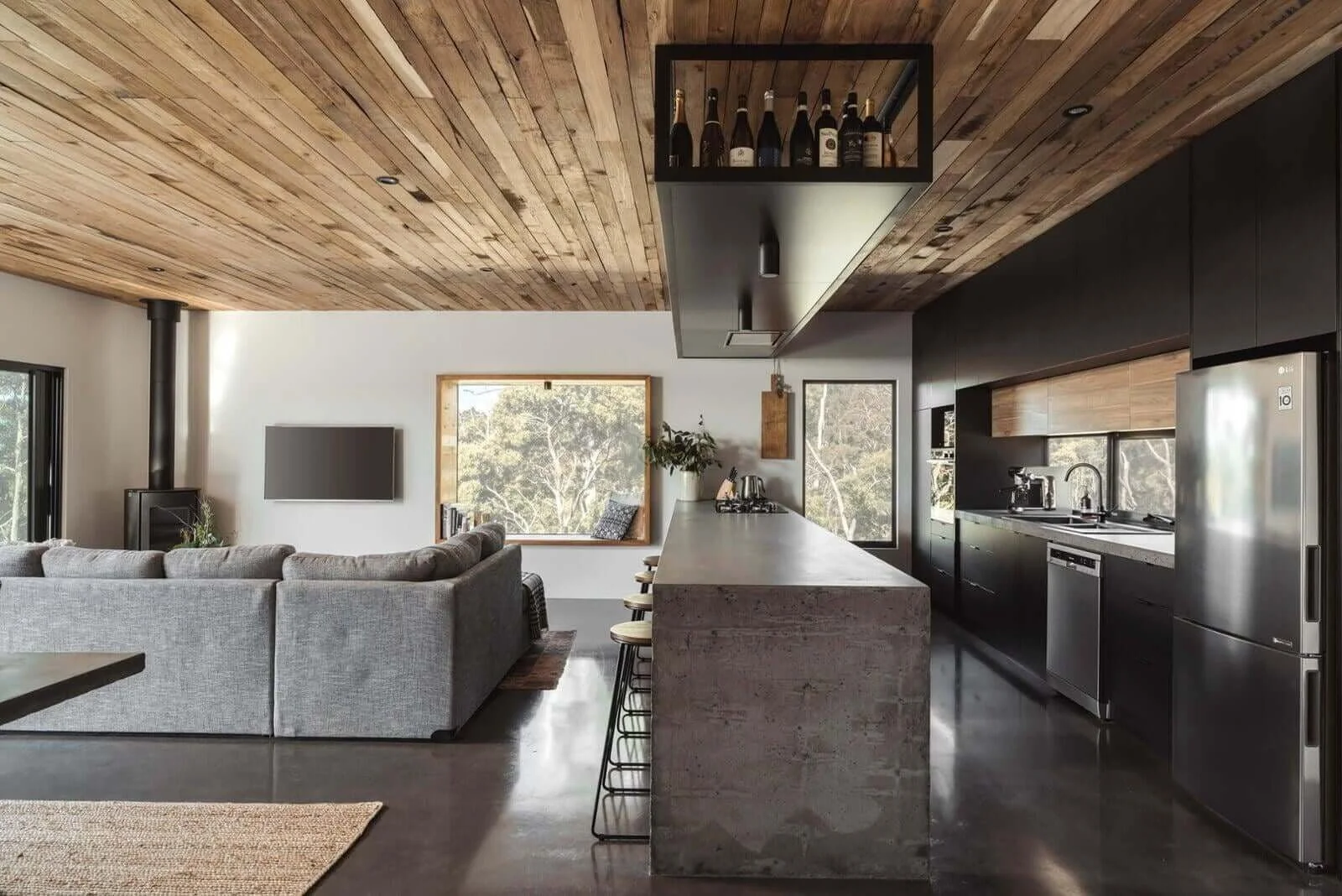 Rural dream home kitchen custom concrete kitchen island bench blackwood timber ceiling open plan living in South Spreyton, Tasmania by Loubser Workshop