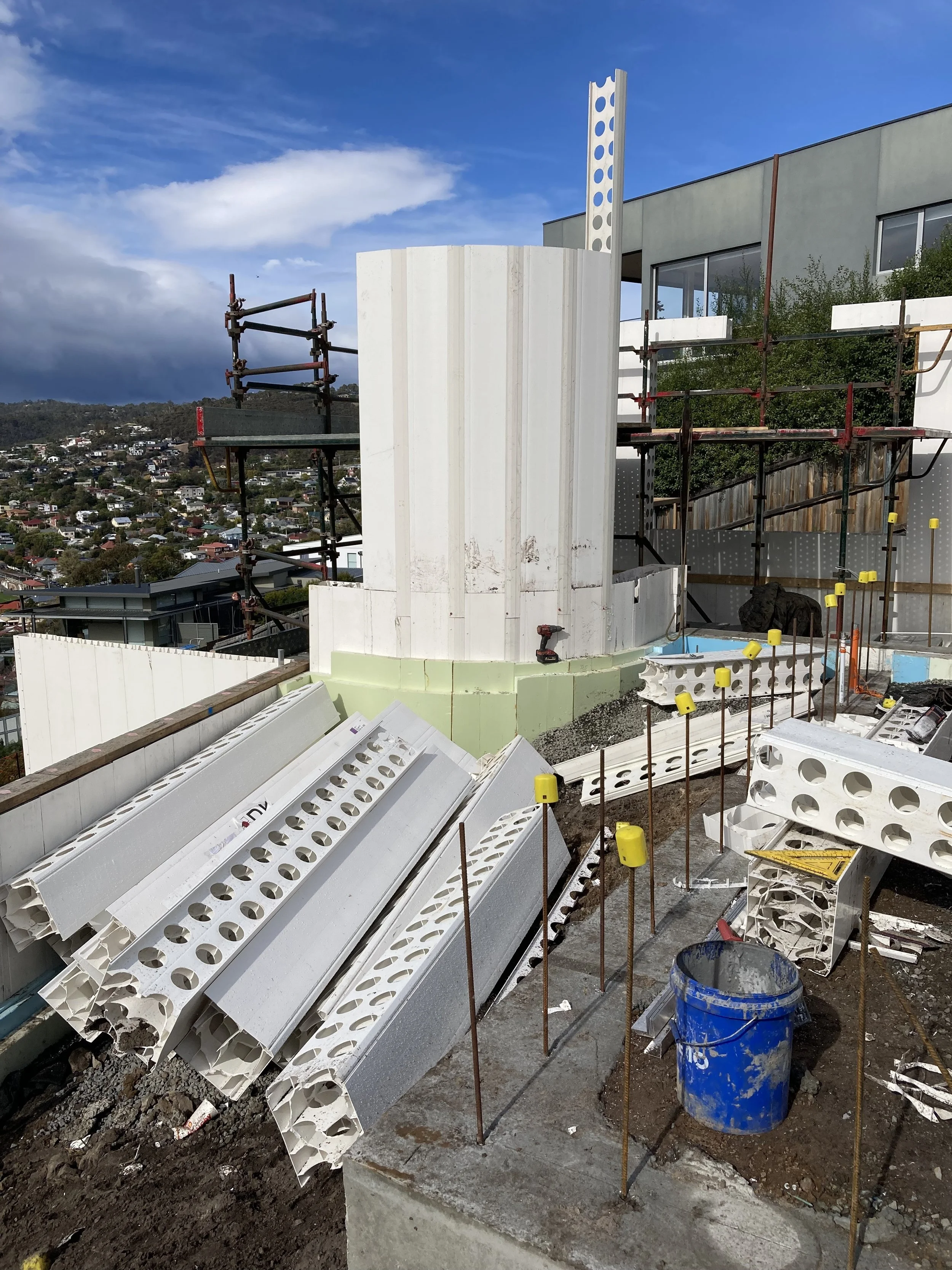 Hobart Hills CLT House. Site construction progress showing curved Dincel wall installation