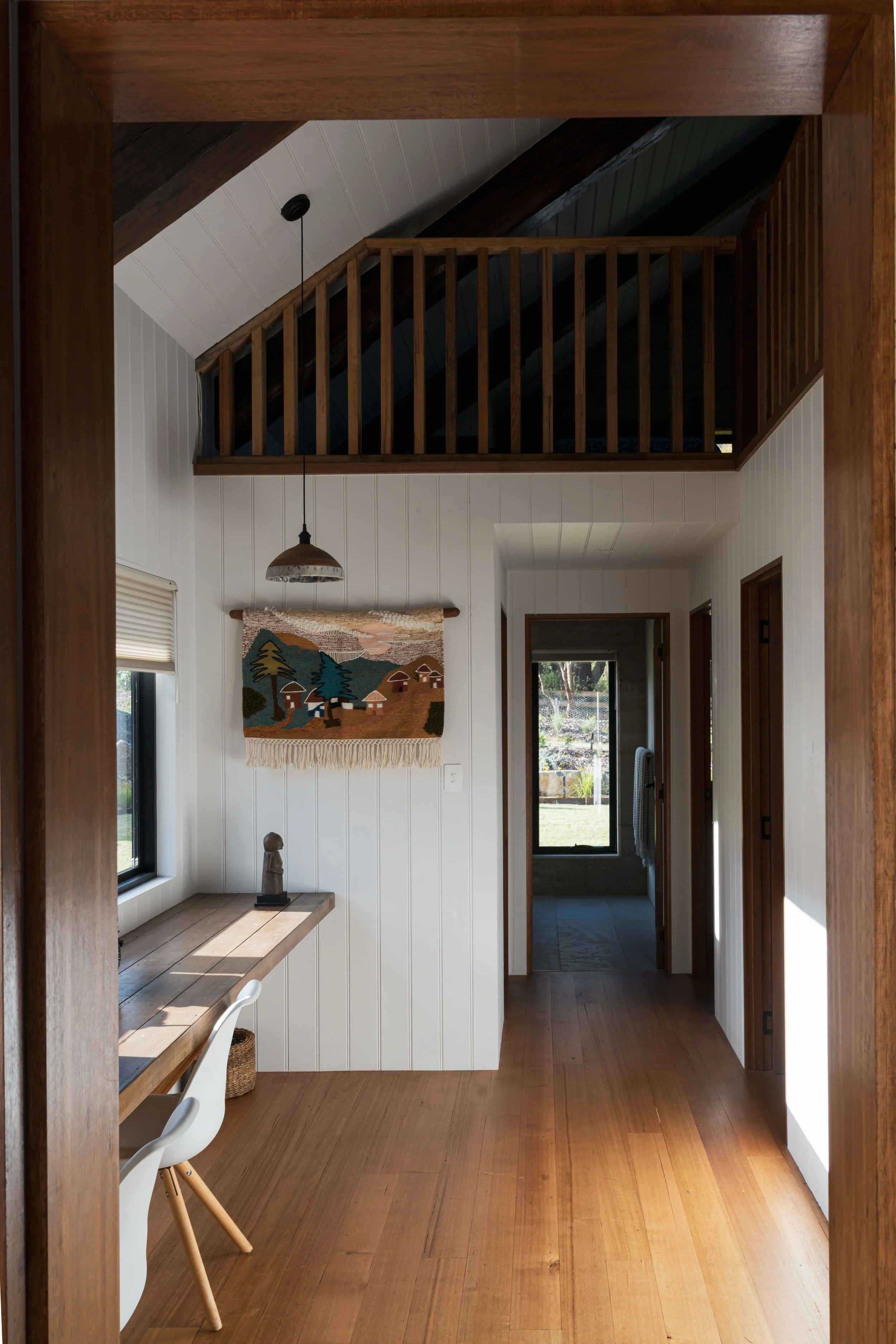 Rural dream home hallway interior with vj panelling, reclaimed Tas Oak doors in Bicheno, Tasmania by Loubser Workshop