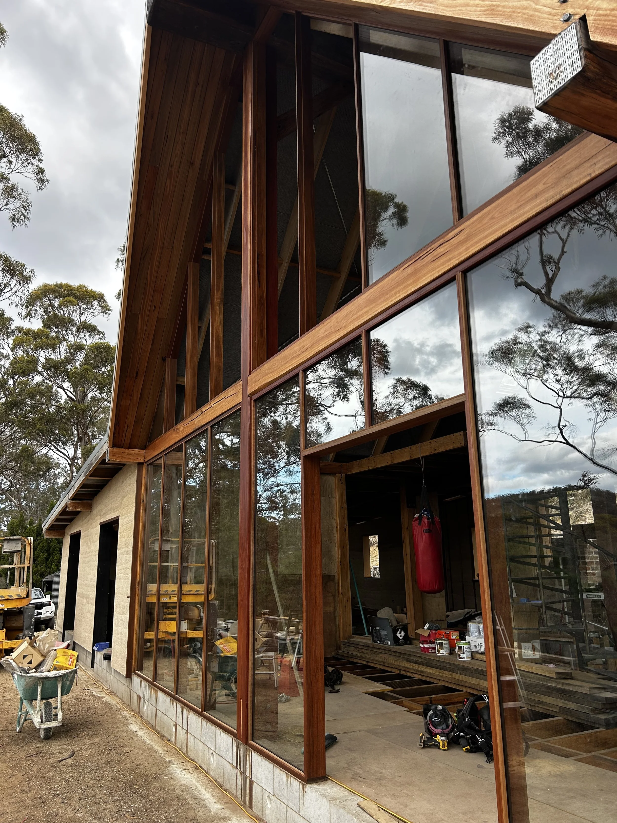Bicheno Bushbuck. Construction progress. Spotted gum facade installed. Double glazed Bushfire rated