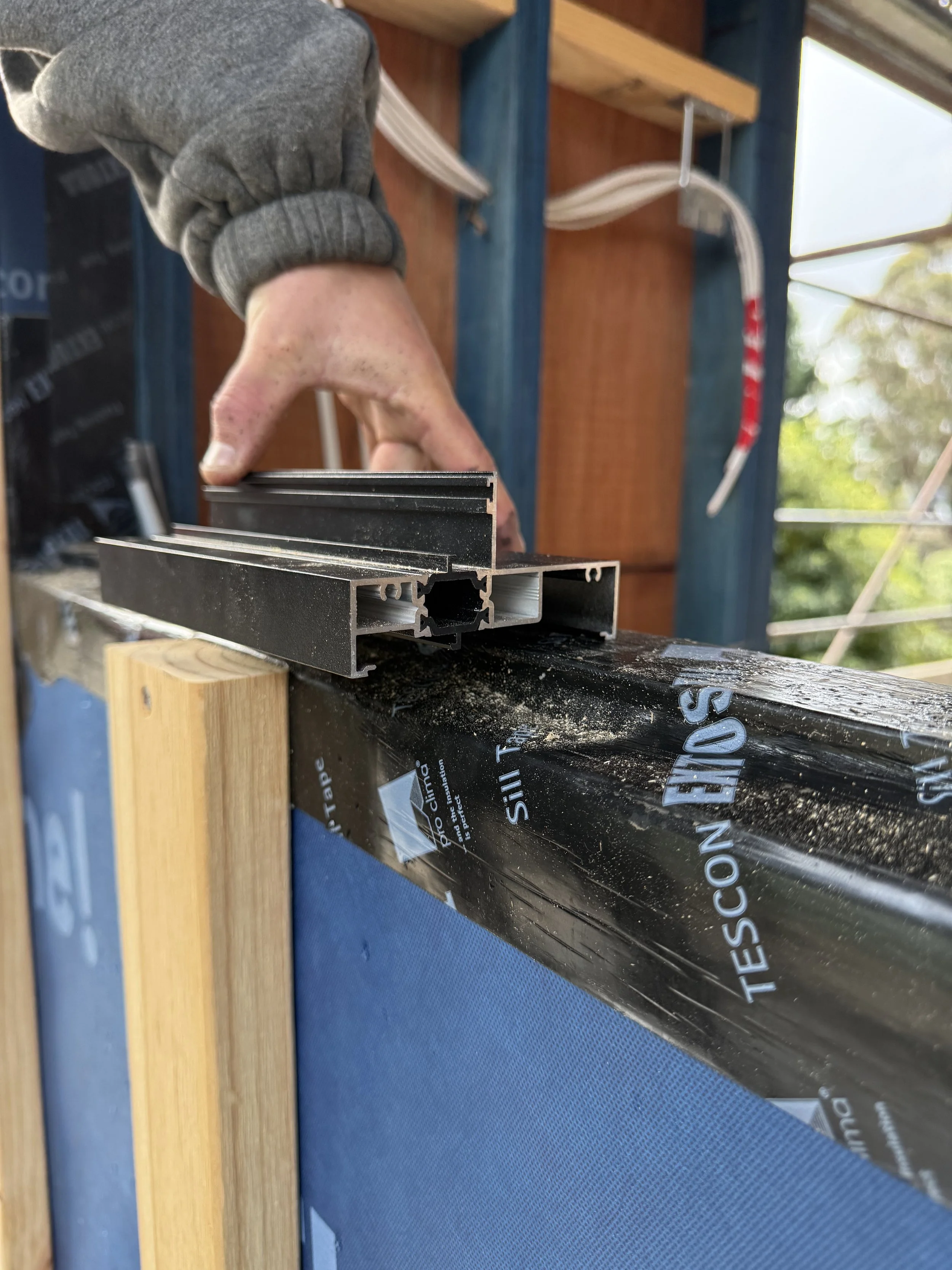 Banyula Butterfly. Photo of thermally broken window installation detail by passive house architect Michael Loubser from LOUBSER WORKSHOP