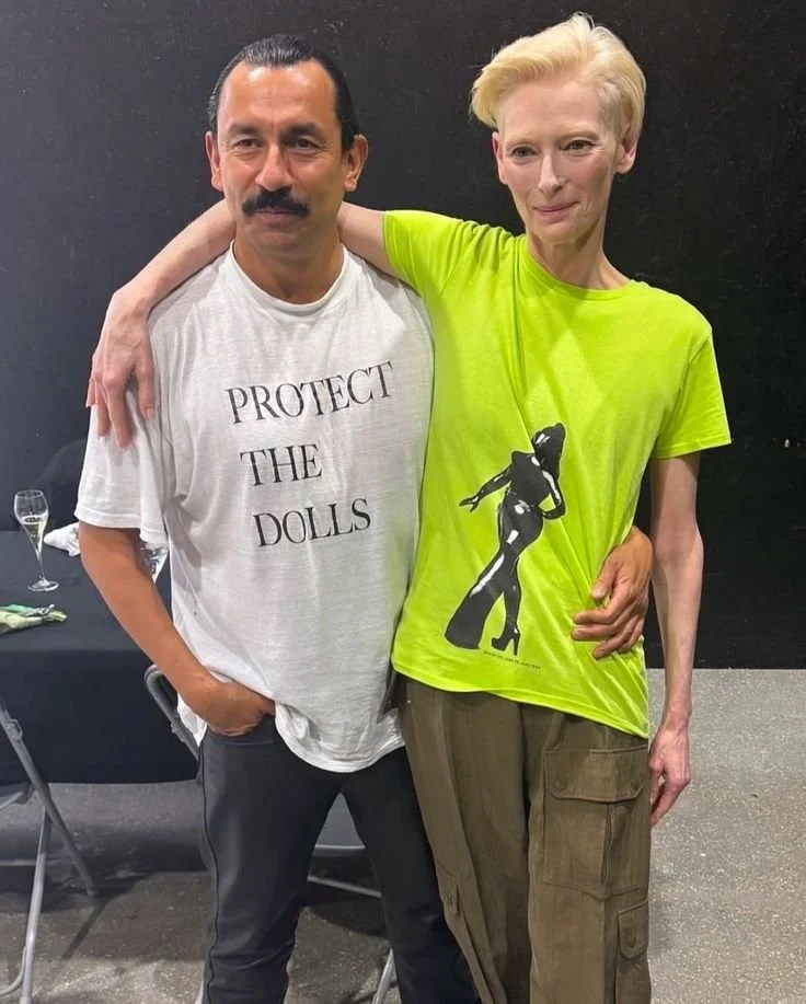 Pedro! Haider! Tilda! Seeing the “Protect the Dolls” T-shirt everywhere_ Soon after its appearance on the runway, the @connerives slogan tee took on a life of its own, adopted by celebrities and designers alike, demonstrating their sol.jpeg
