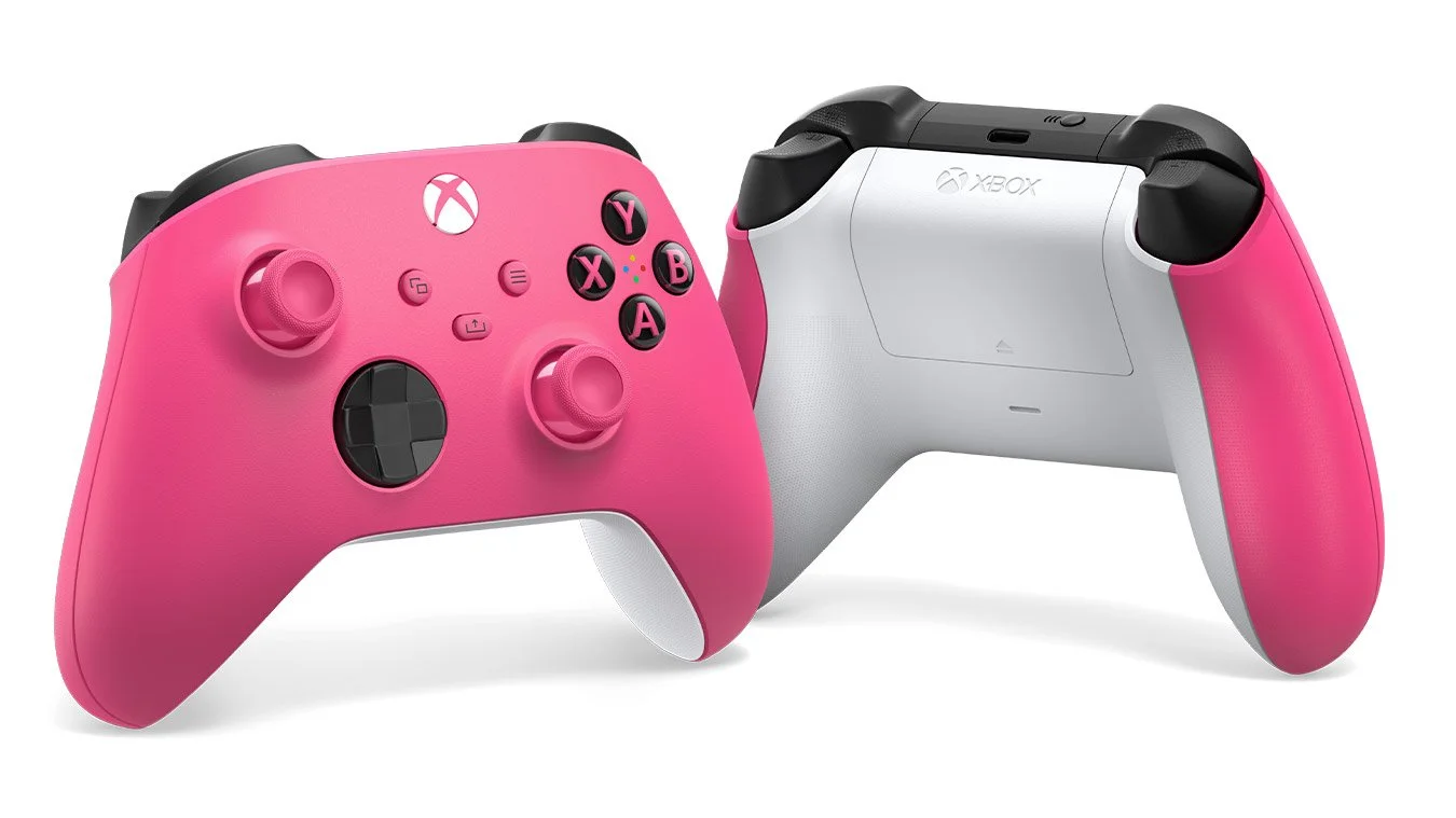 Two pink and white Xbox wireless controllers.