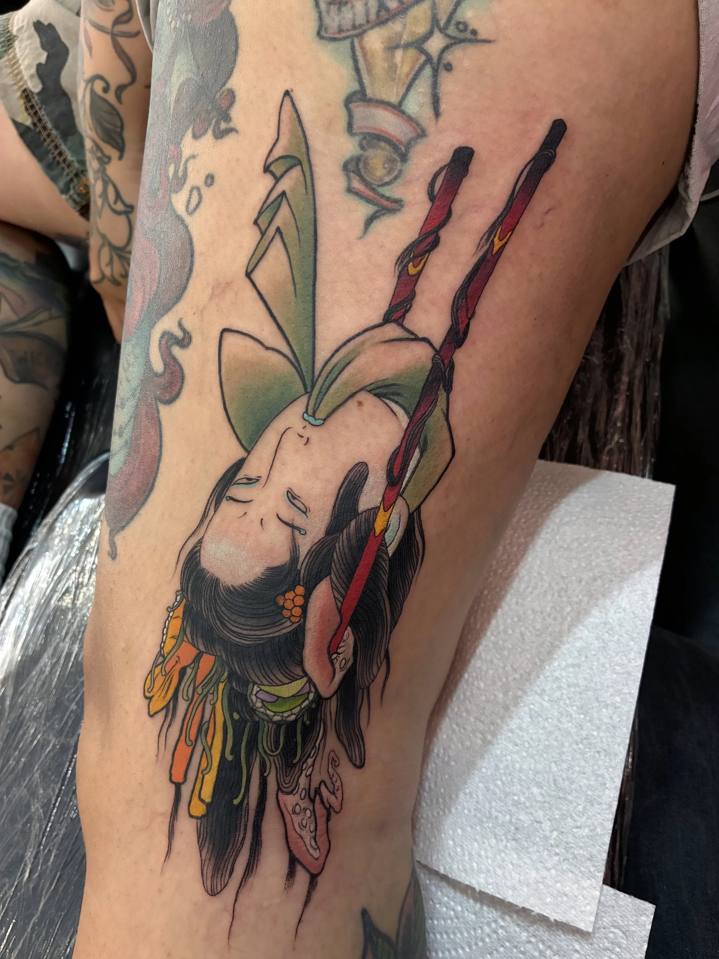 The brief was a lady head being held by chopsticks so we came up with this sushi girl to fit the available space on the side of the leg / knee.