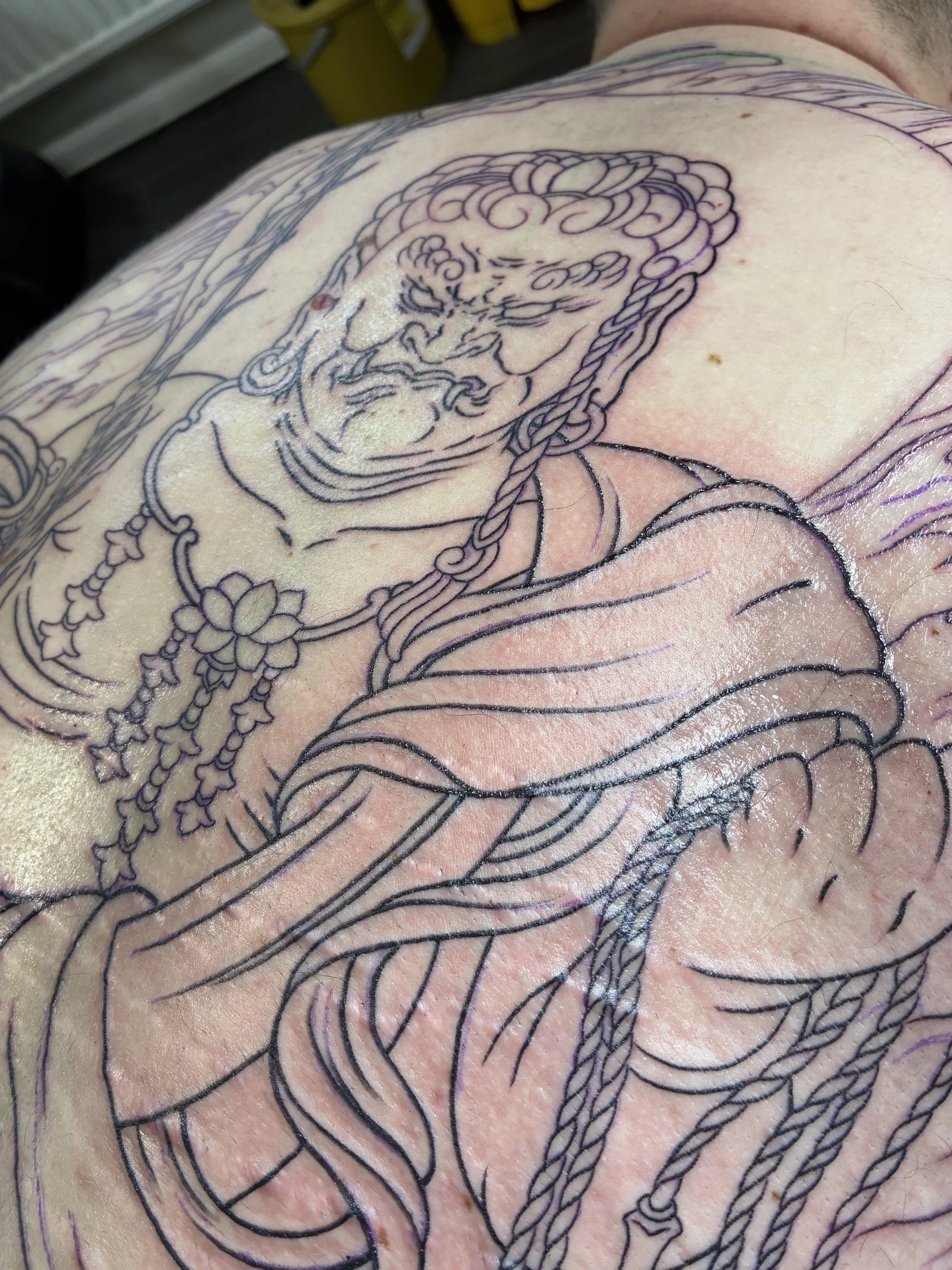 The powerful deity Food Myoo, "The Immovable One" 
A photo taken straight after the initial session to outline this full Japanese back piece tattoo.
