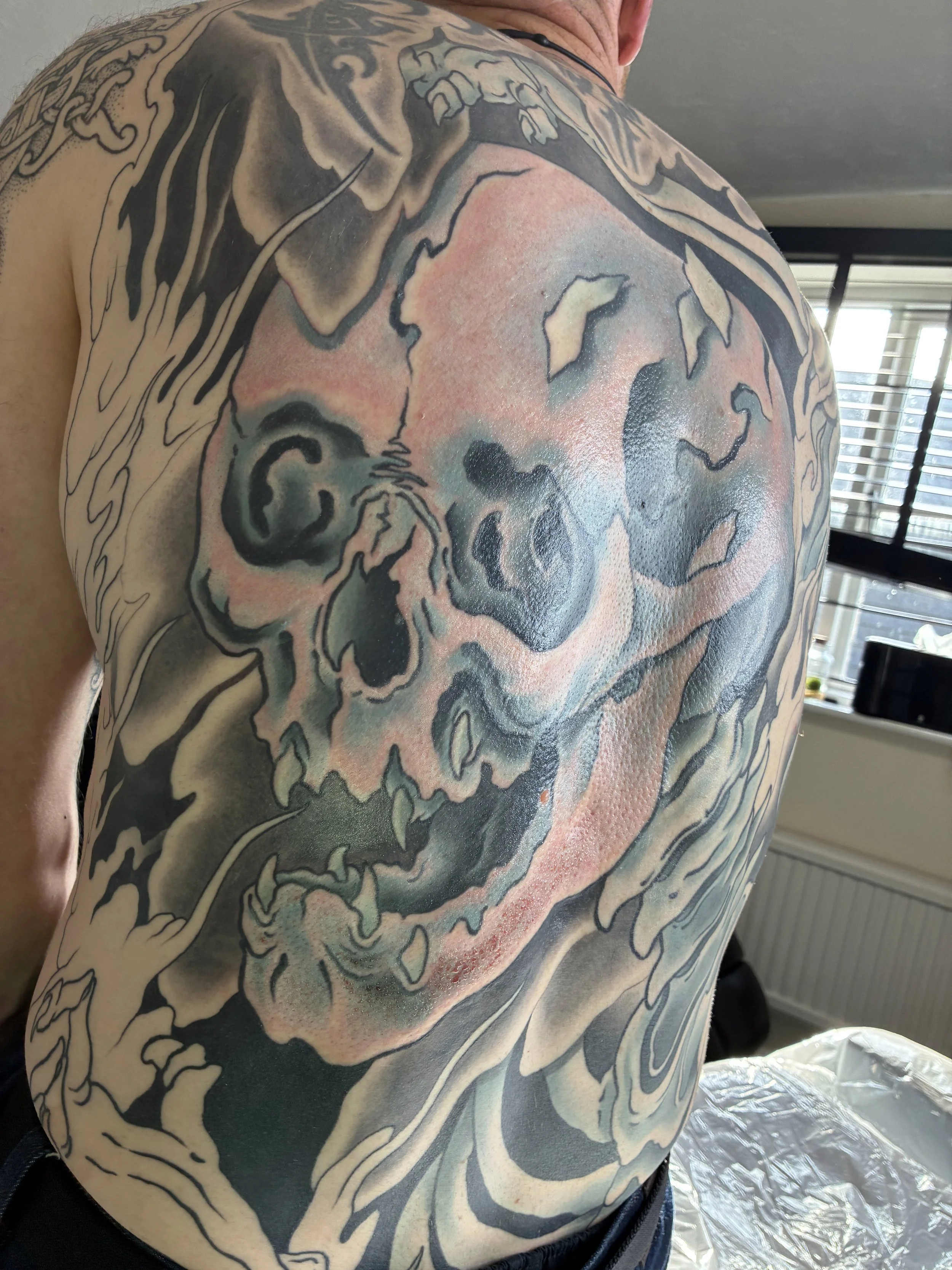 A candid snapshot of this Gashadokuro yokai back piece tattoo, the end of the session and waiting to be wrapped. Always progressing, always moving forwards with commitment and dedication to not only the end result but also the personal journey.