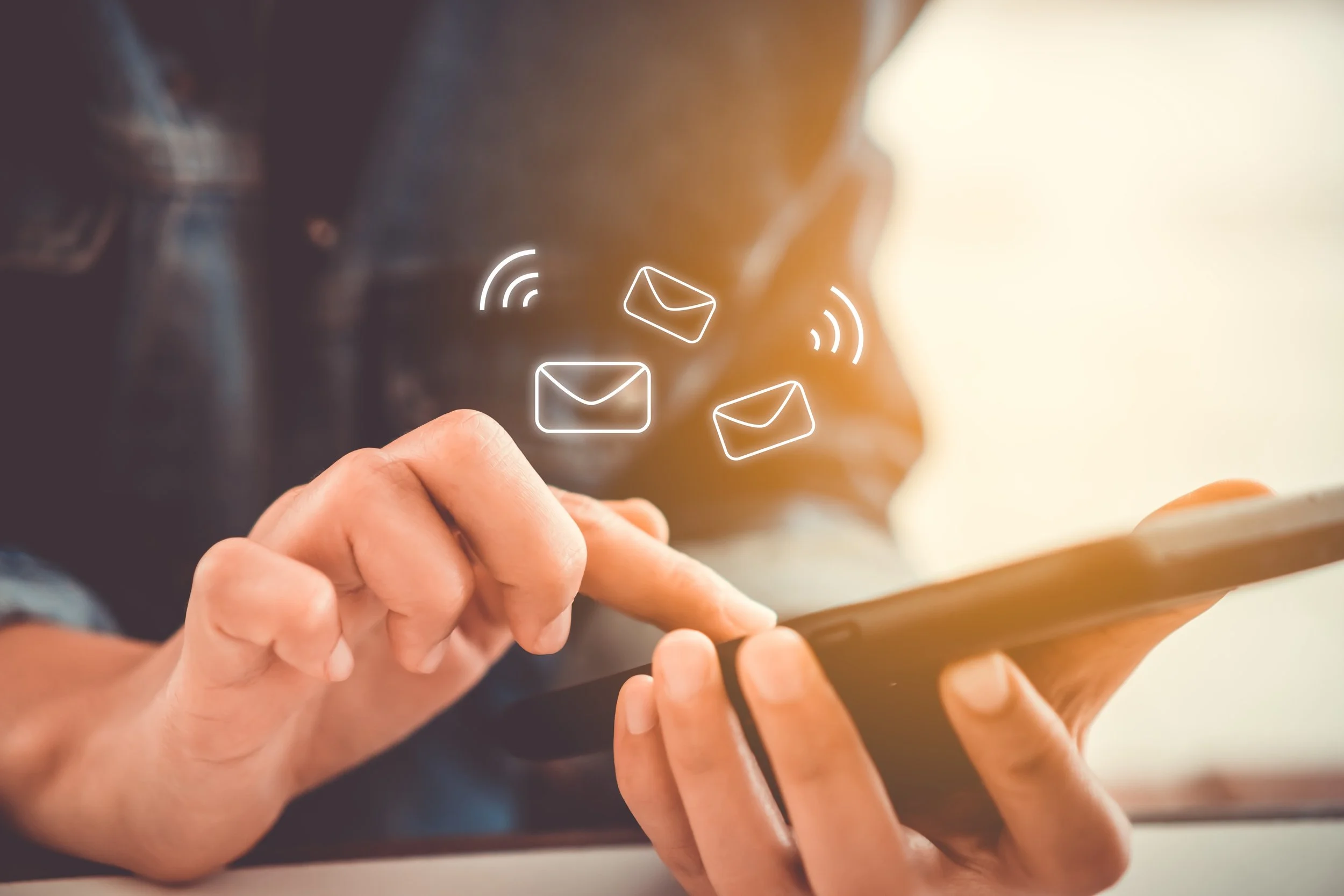 Someone using a device to send an email