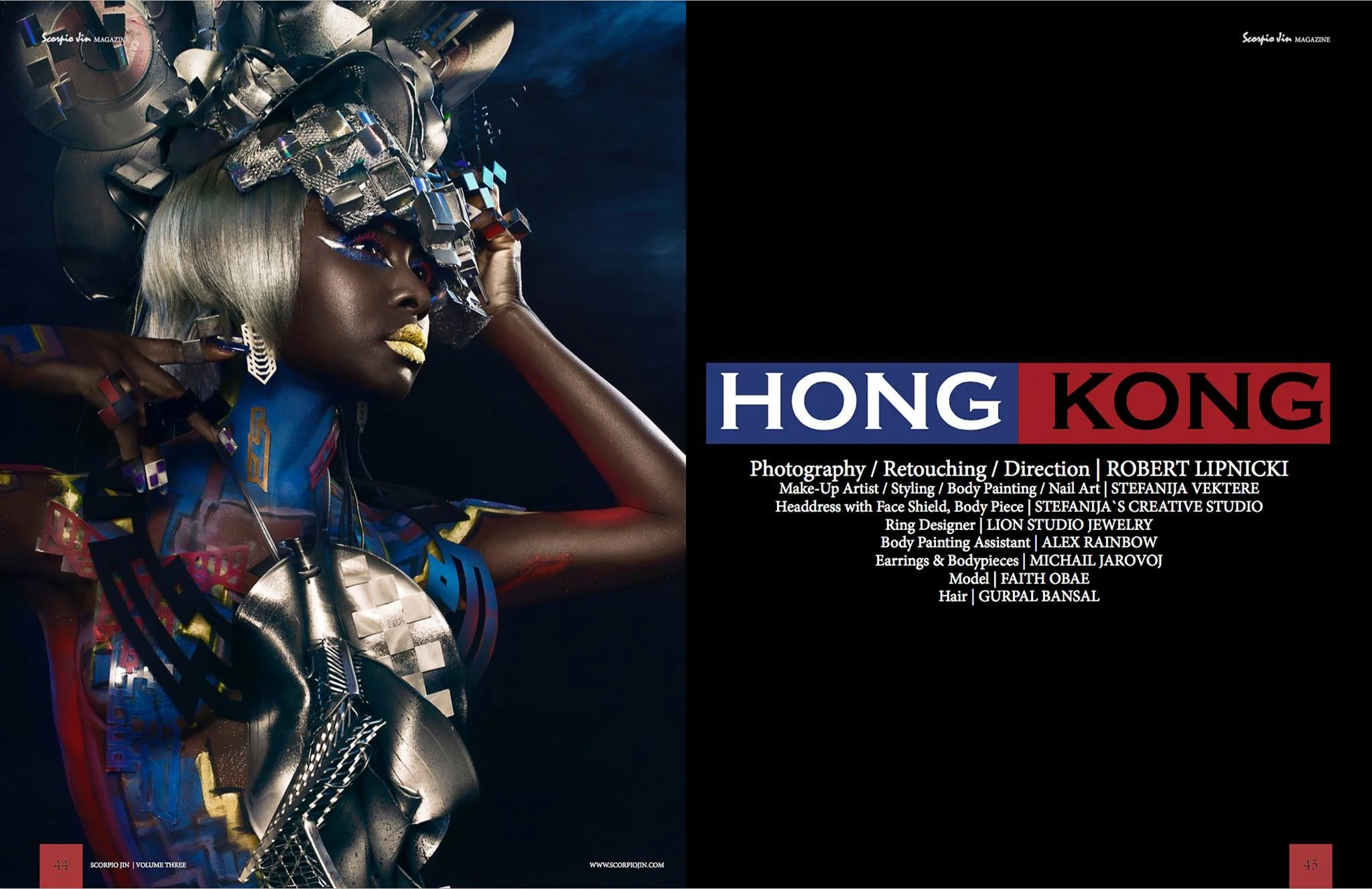 A woman with dark skin features in futuristic, edgy attire with metallic and colorful accessories, silver hair, and bold makeup, posing against a dark background.