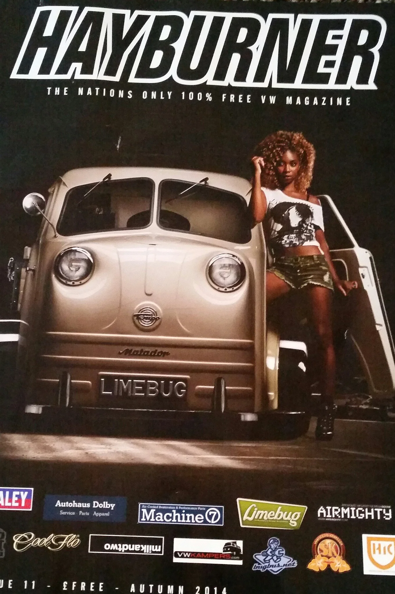 The cover of a magazine titled 'HAYBURNER' featuring a vintage microcar with a woman standing beside it, set against a dark background. The magazine claims to be 'The Nations Only 100% Free VW Magazine' and includes various sponsor logos at the botto
