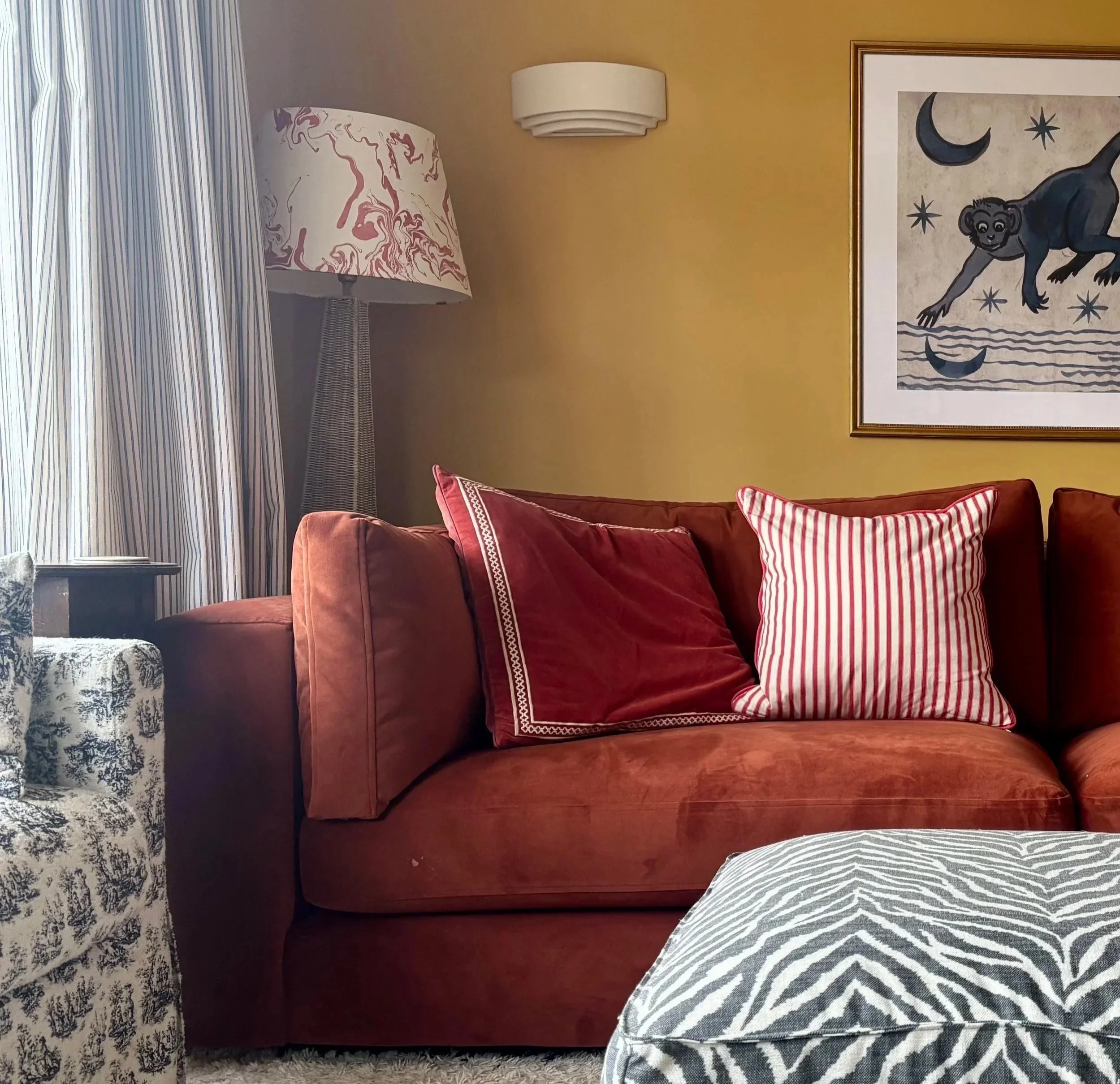 red sofa in yellow room