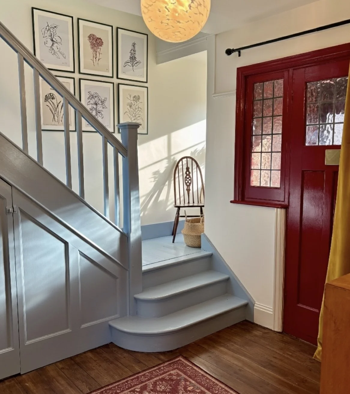 Blue stairs and red door