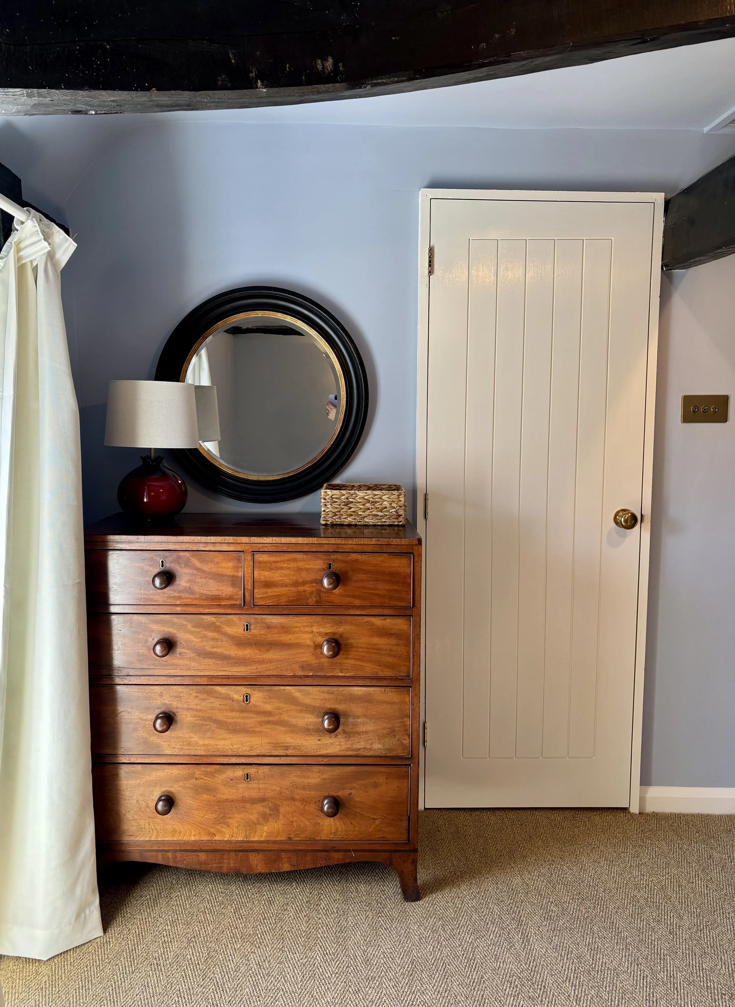 Chest of drawers in blue bedroom