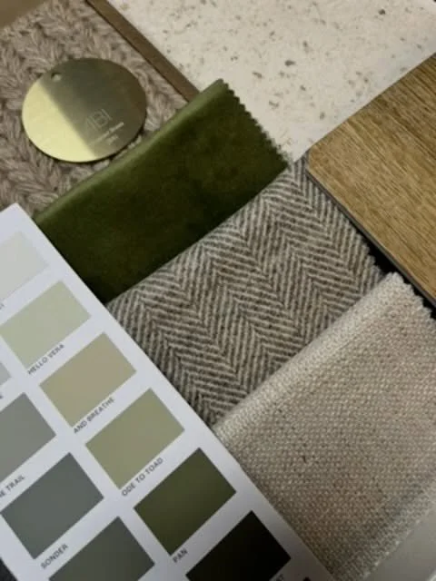 November is about creating calm, grounded comfort with a hint of earthy winter warmth.

This moodboard leans into sage greens and moss tones, tactile wool braids, soft herringbone weaves, brushed brass details and warm timber, layered with natural te