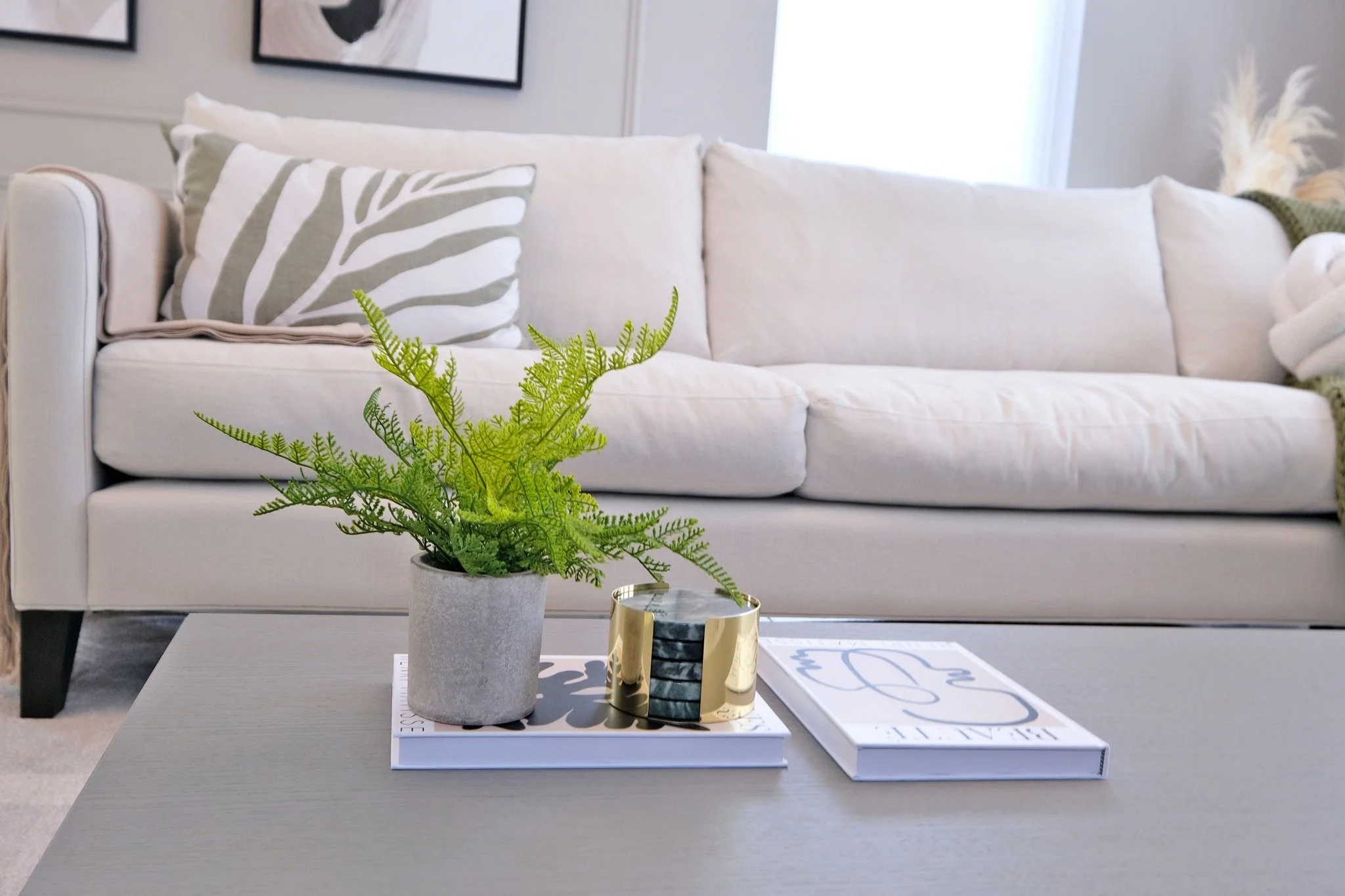 As daylight grows stronger and rooms begin to feel lighter, heavy styling and crowded surfaces can suddenly feel overwhelming. Clearing a table, console, or kitchen counter allows the space to breathe and lets the materials, textures, and light becom