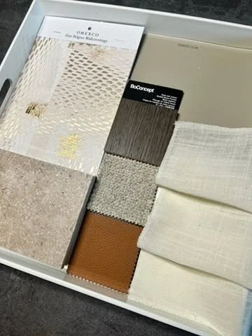 Envisioning a refined, contemporary living space.

This concept is grounded by a timeless limestone floor and elevated through a rich layering of textures, from supple tan leather to tactile beige upholstery and deep toned wood accents that bring war