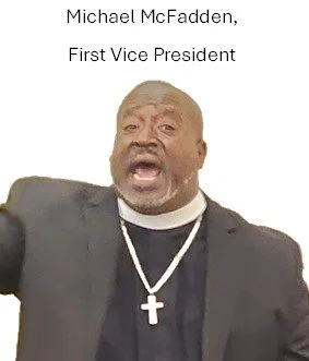 A man dressed as a clergy member with a clerical collar and cross necklace, speaking passionately with his mouth open.