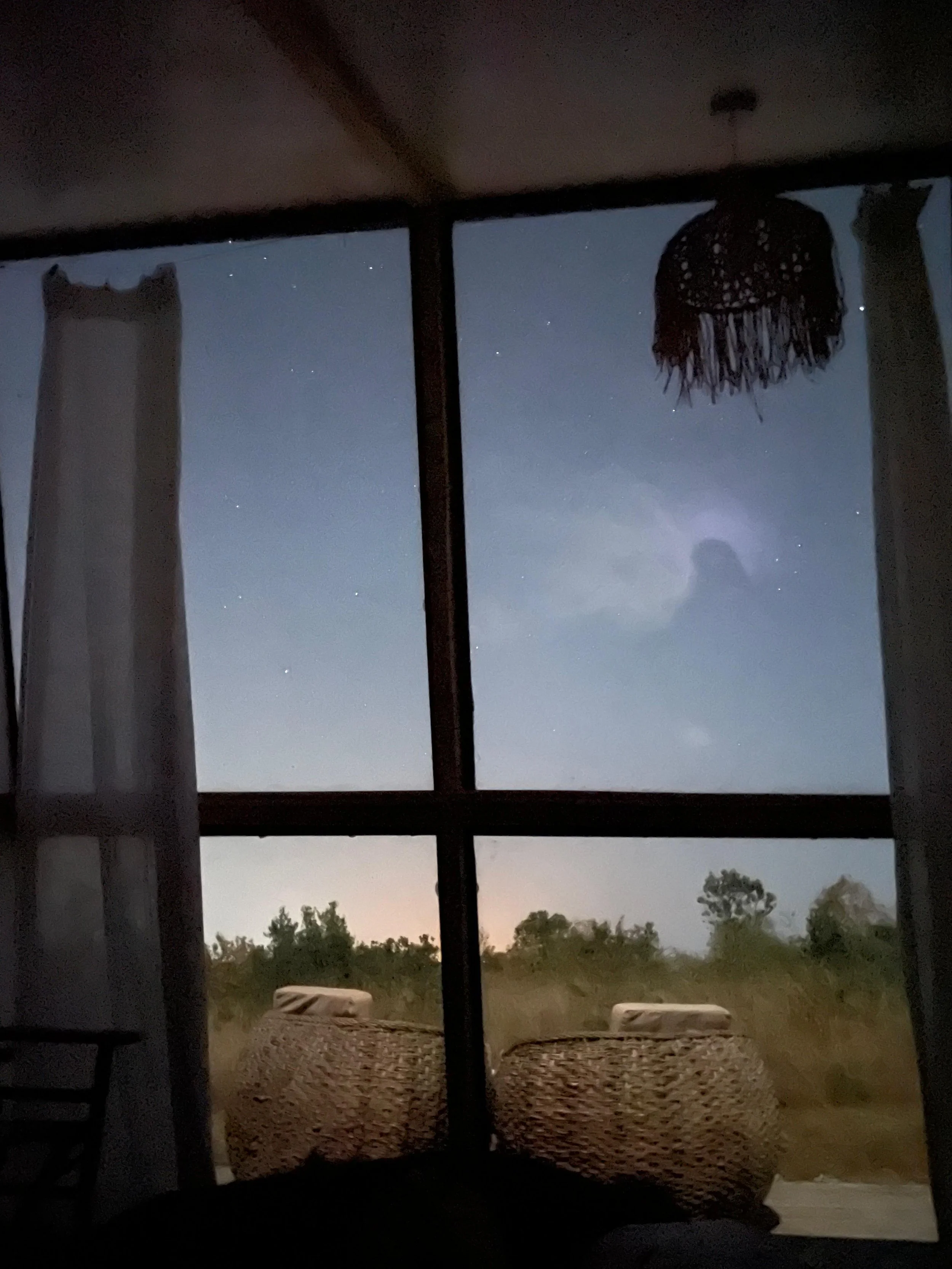 View from the bed into the starry night sky