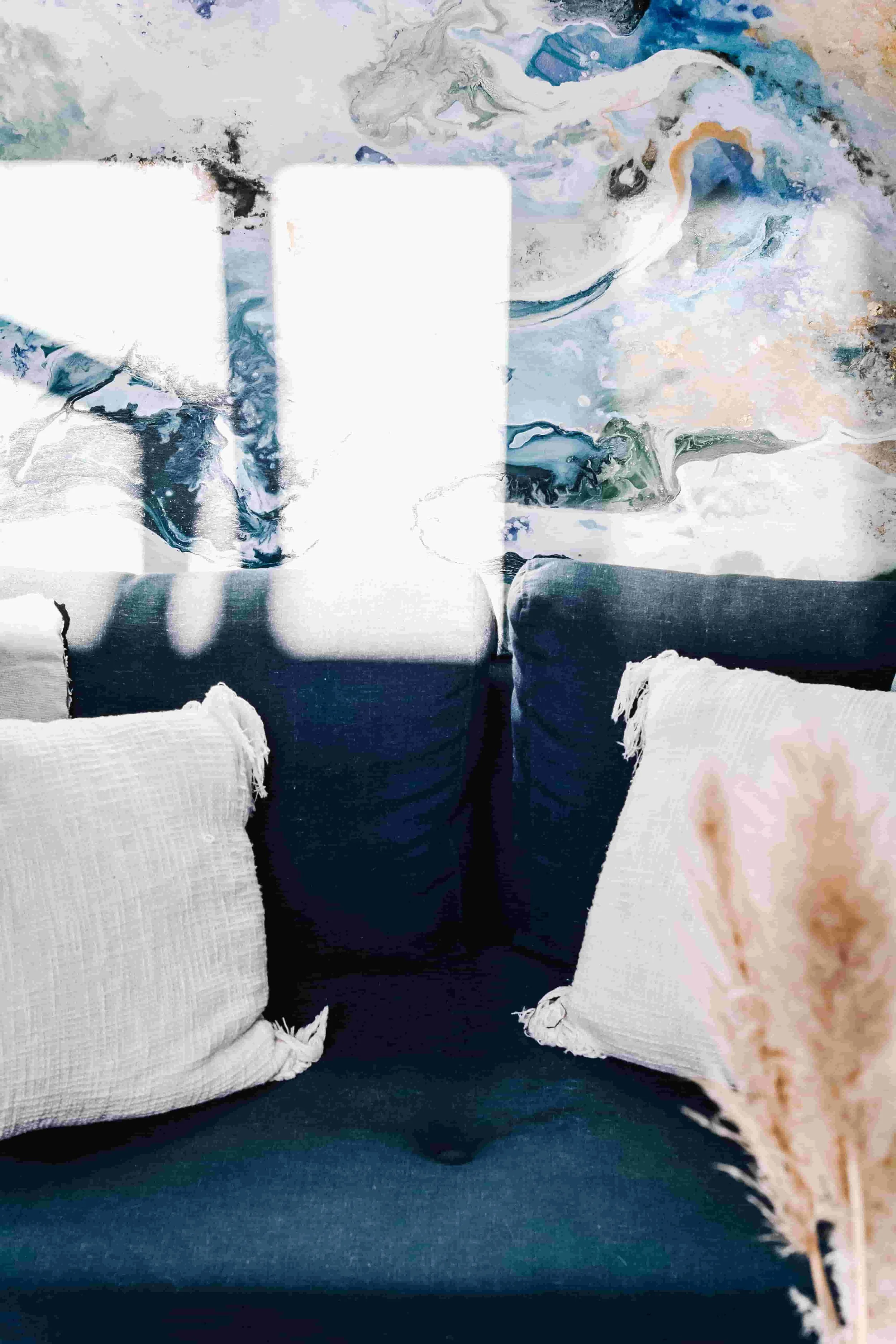 Therapy room with blue sofa at Denise Wolf Psychotherapy practice in Ibiza