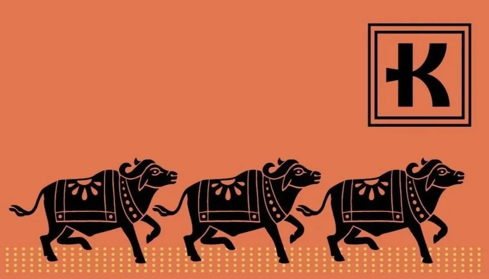 Karravaan gift card. Stylized black elephants with decorative patterns walking in a line on an orange background with a letter 'K' inside a square in the upper right corner.