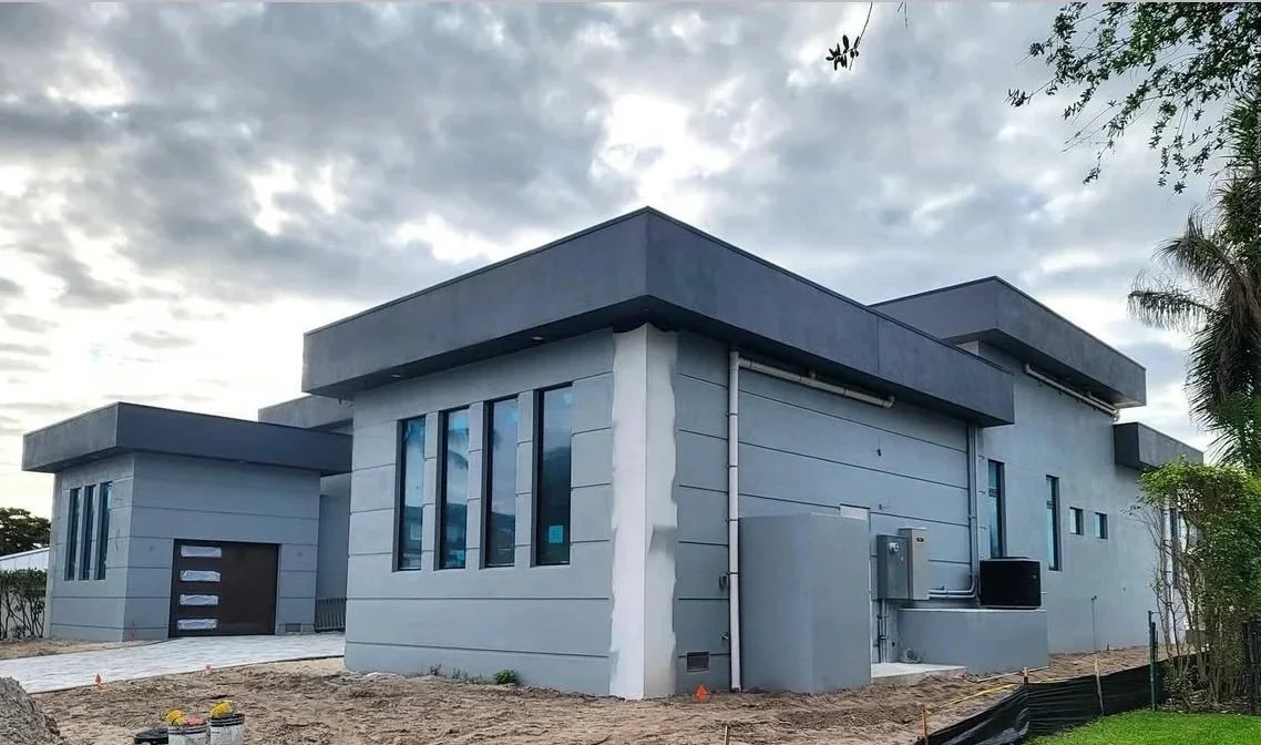 Modern SWFL home with stucco lap siding provided by Badger Builders Inc.