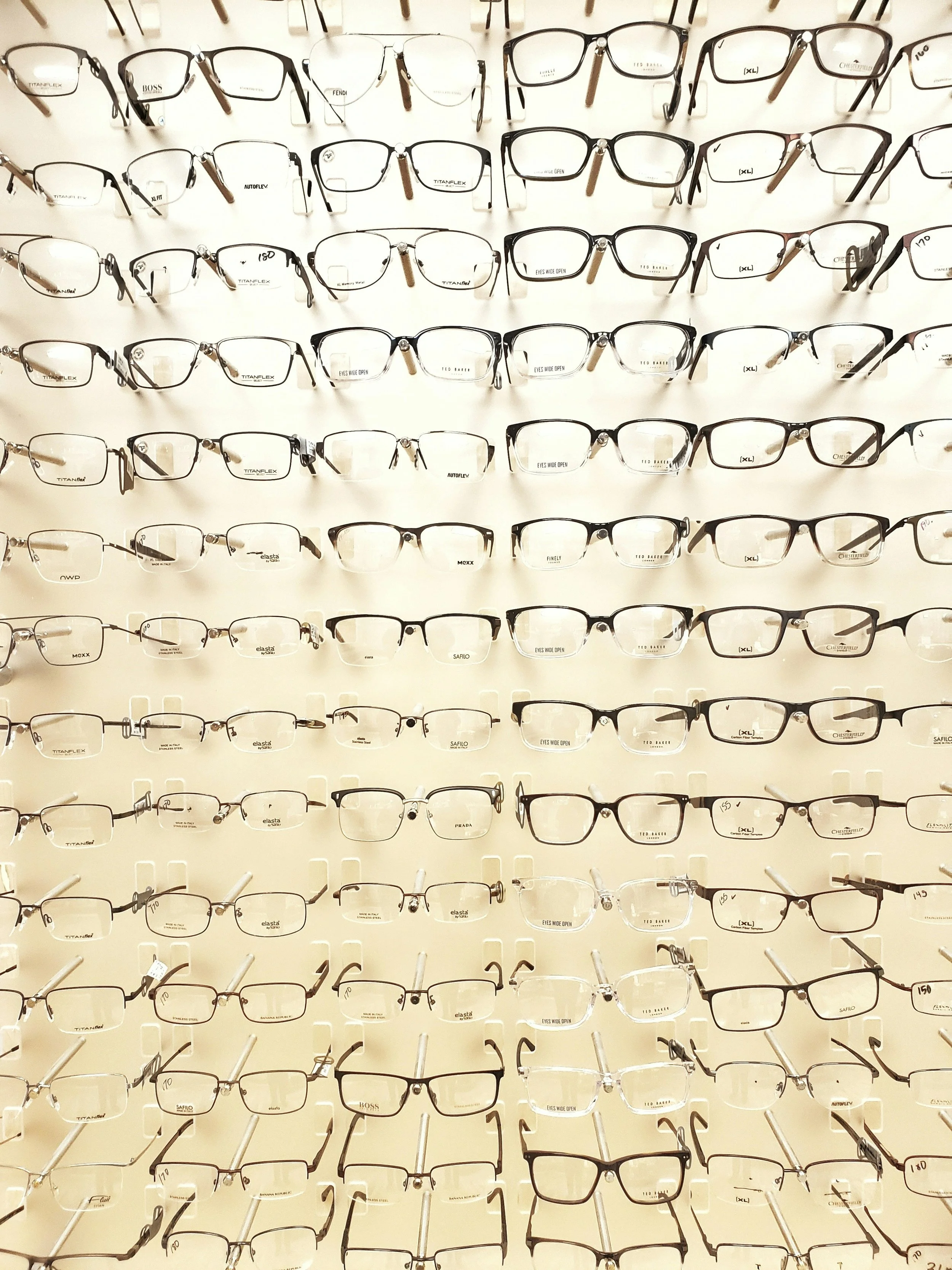 Large quantity of glasses on a wall.