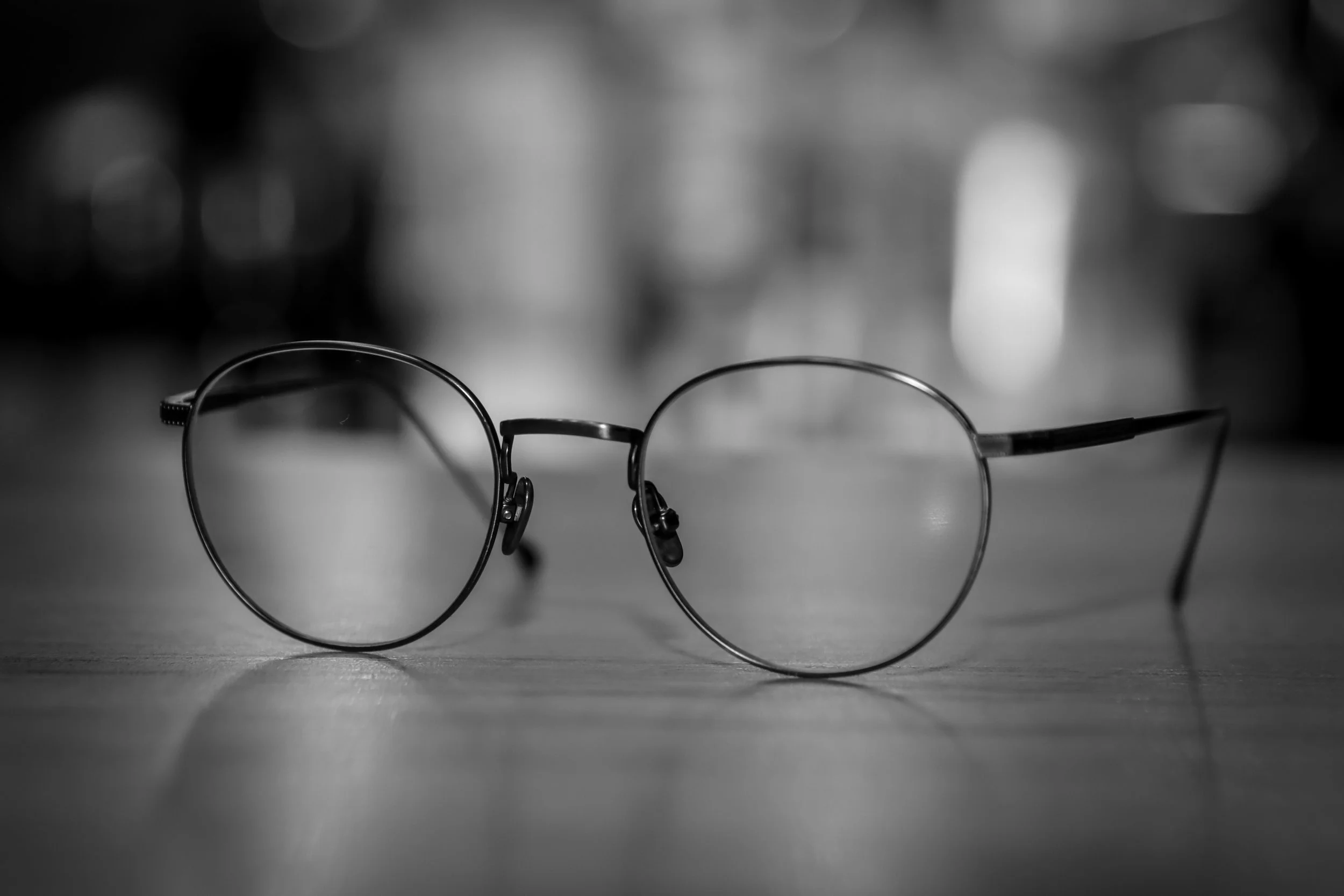 Pair of glasses with grey background.
