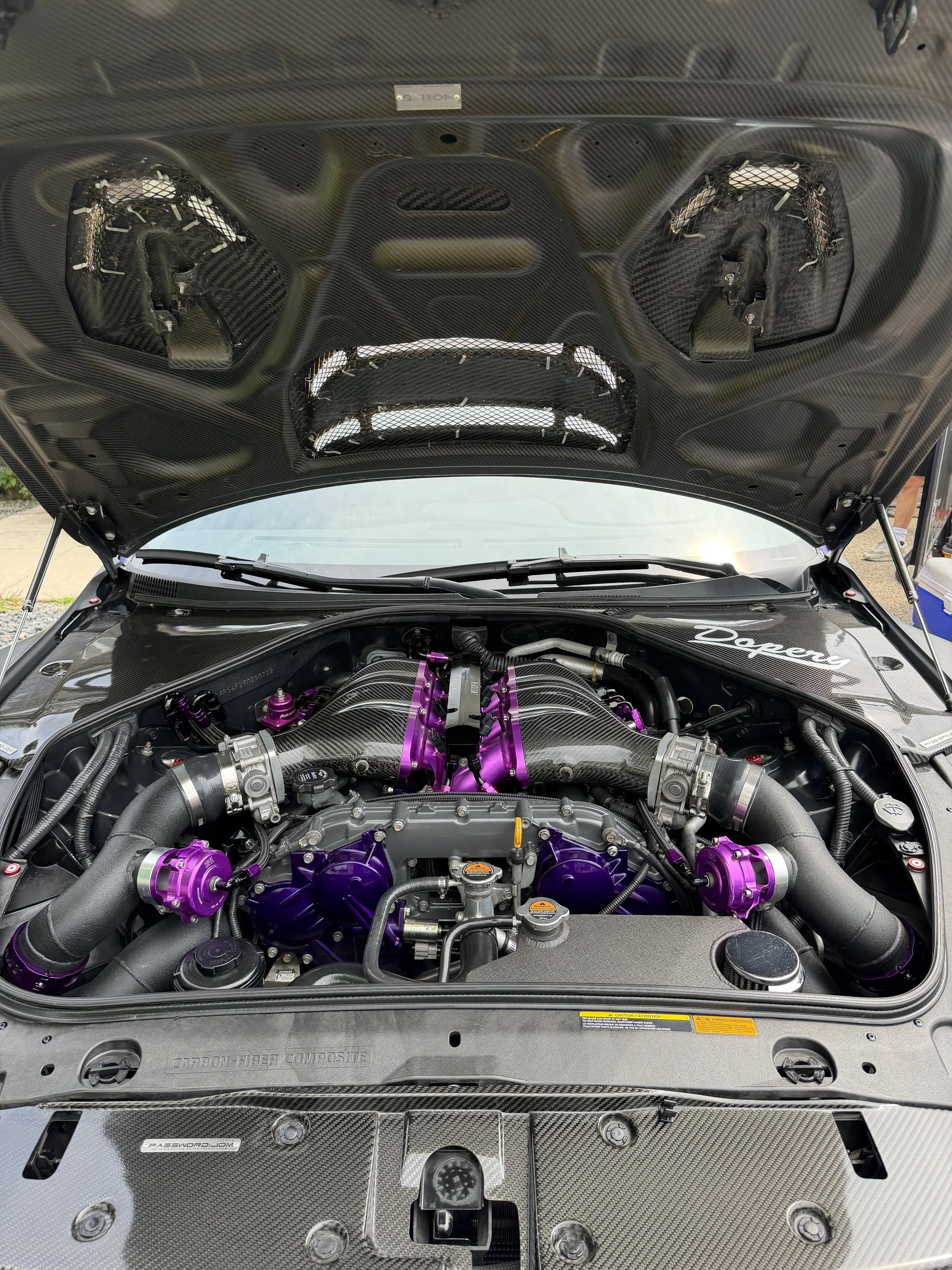 Freshly detailed engine bay of the purple Nissan GTR. 