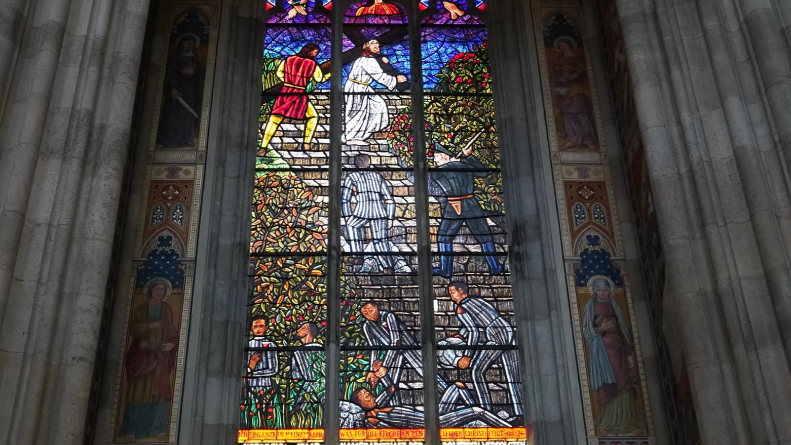 Some of the stained glass windows depict scenes from the Holocaust 