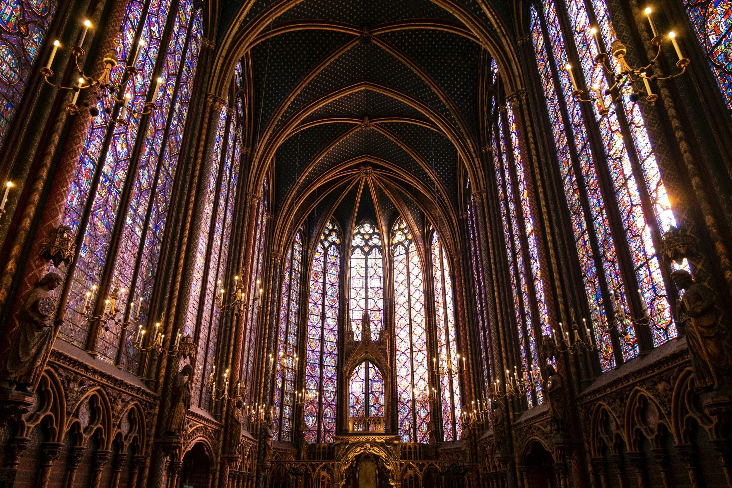 Interior of the Sainte-Chapelle in Paris, France. With stained glass windows and intricate architectural details.