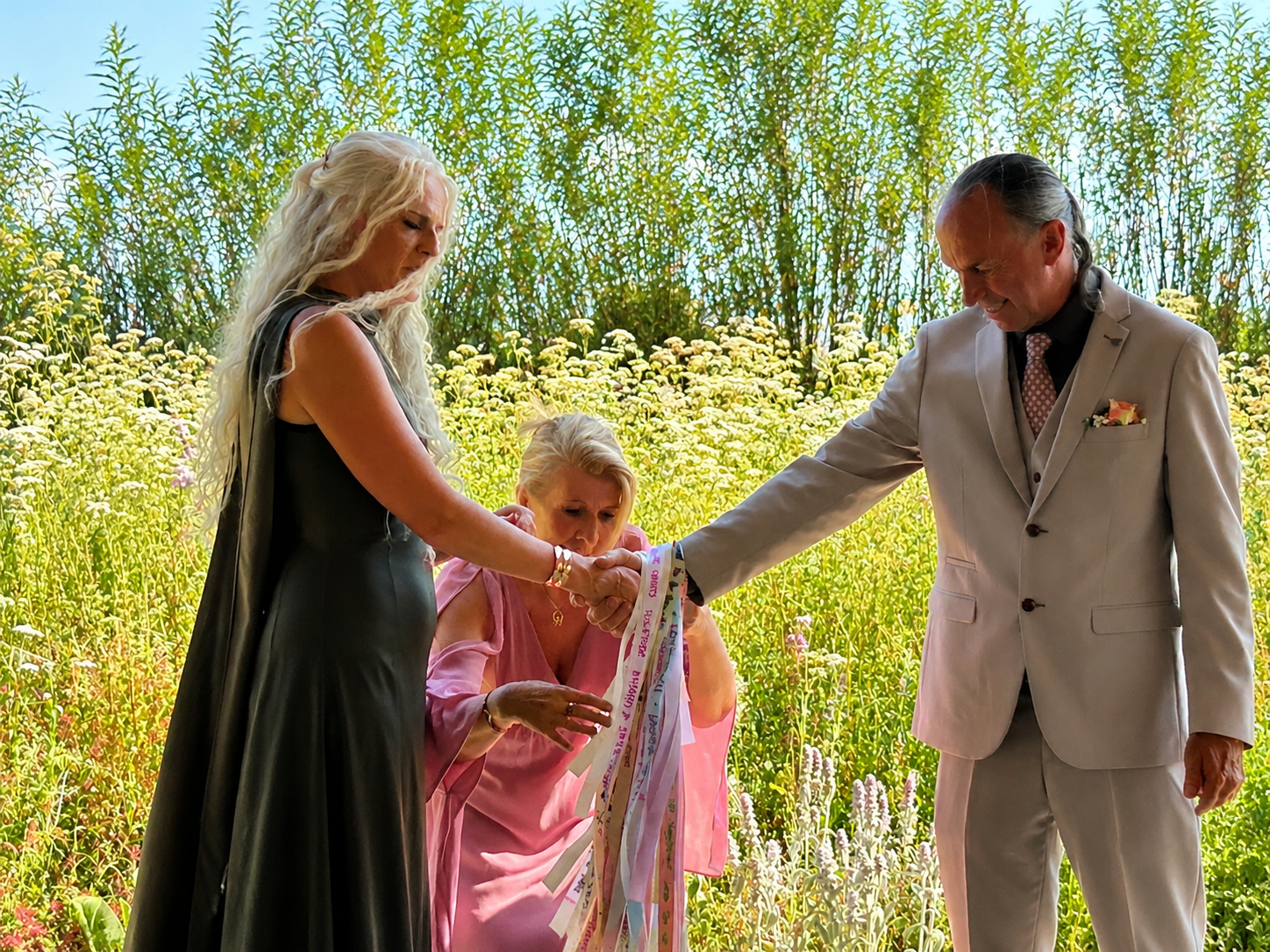 Kirsten doing a handfasting at a vow renewal ceremony