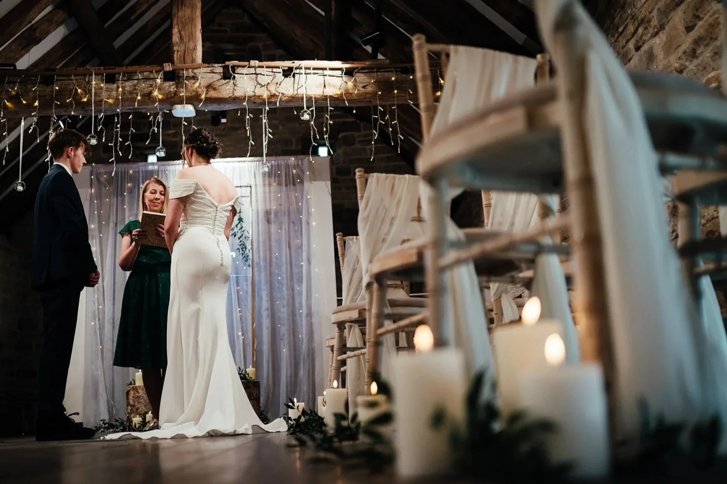 Kirsten from Lovebird Ceremonies wearing a green dress at Dronfield Barn