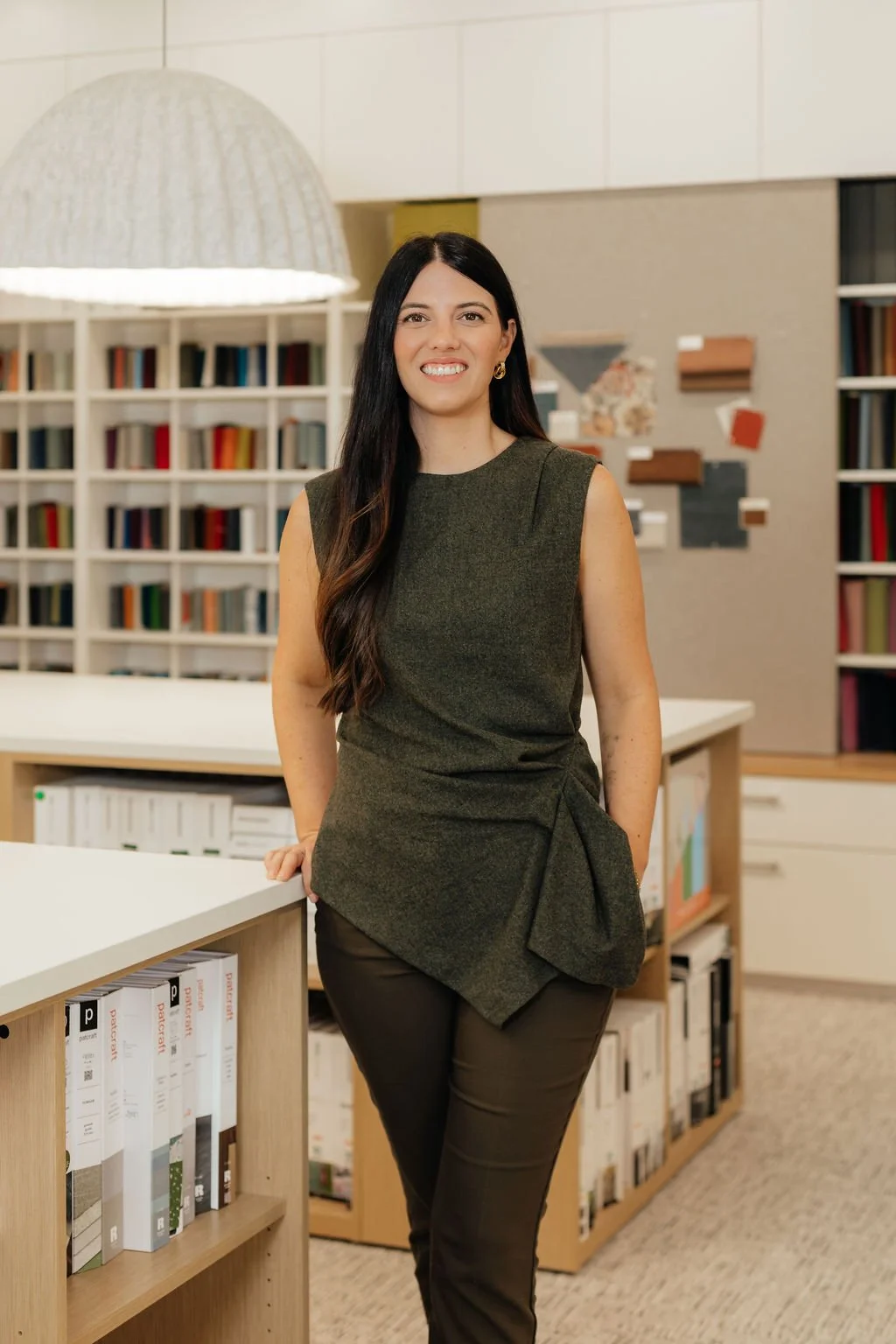 Natalie Oursbourn standing in Groom Office Environments Design Library