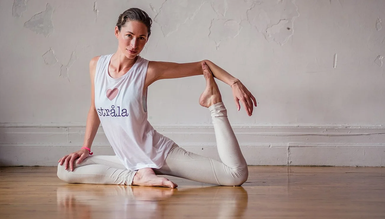 women holding yoga pose