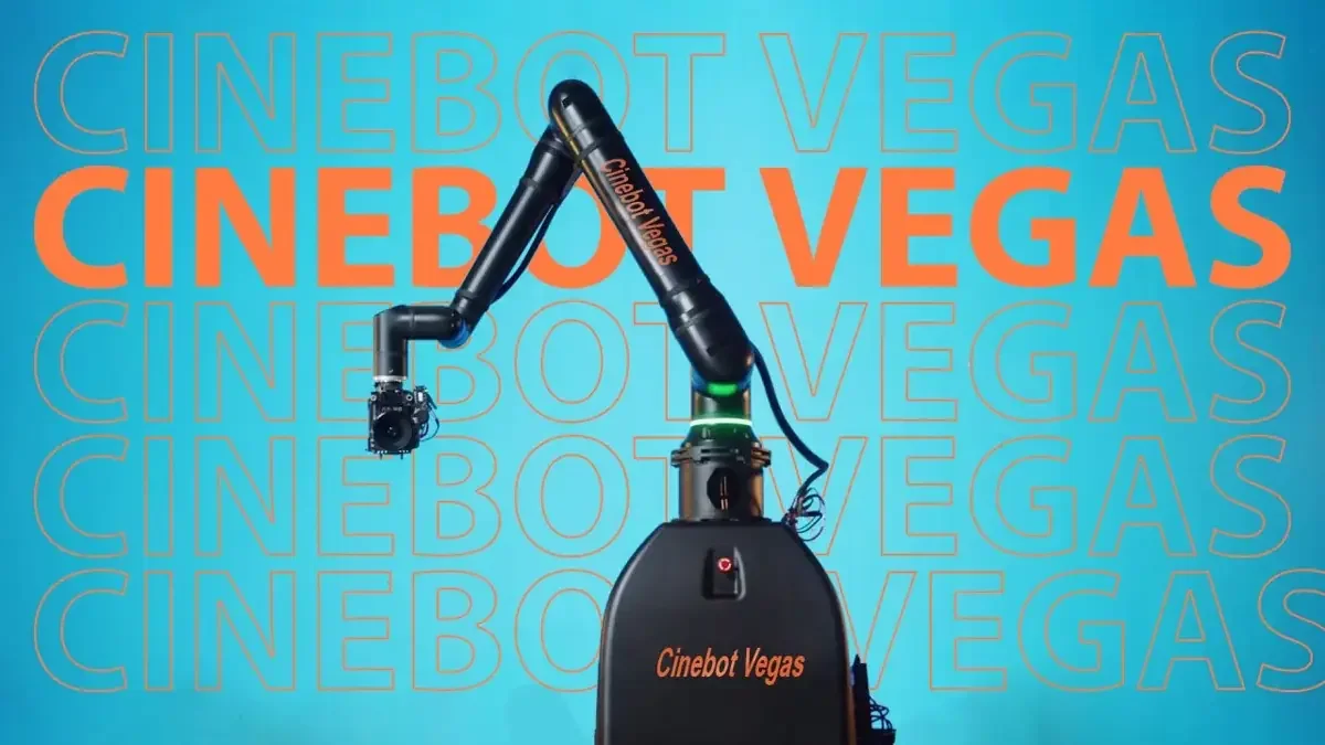 Cinebot Vegas robotic camera arm and pedestal against a turquoise branded background