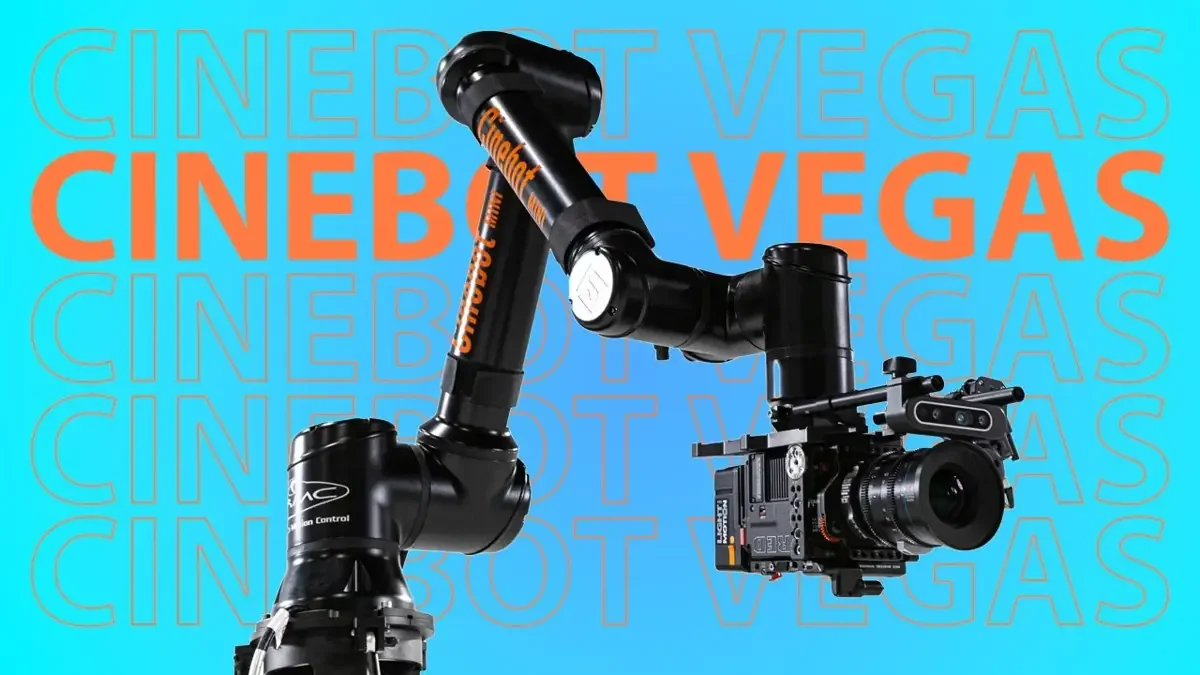 Cinebot Max robotic arm holding a cinema camera against a turquoise branded background