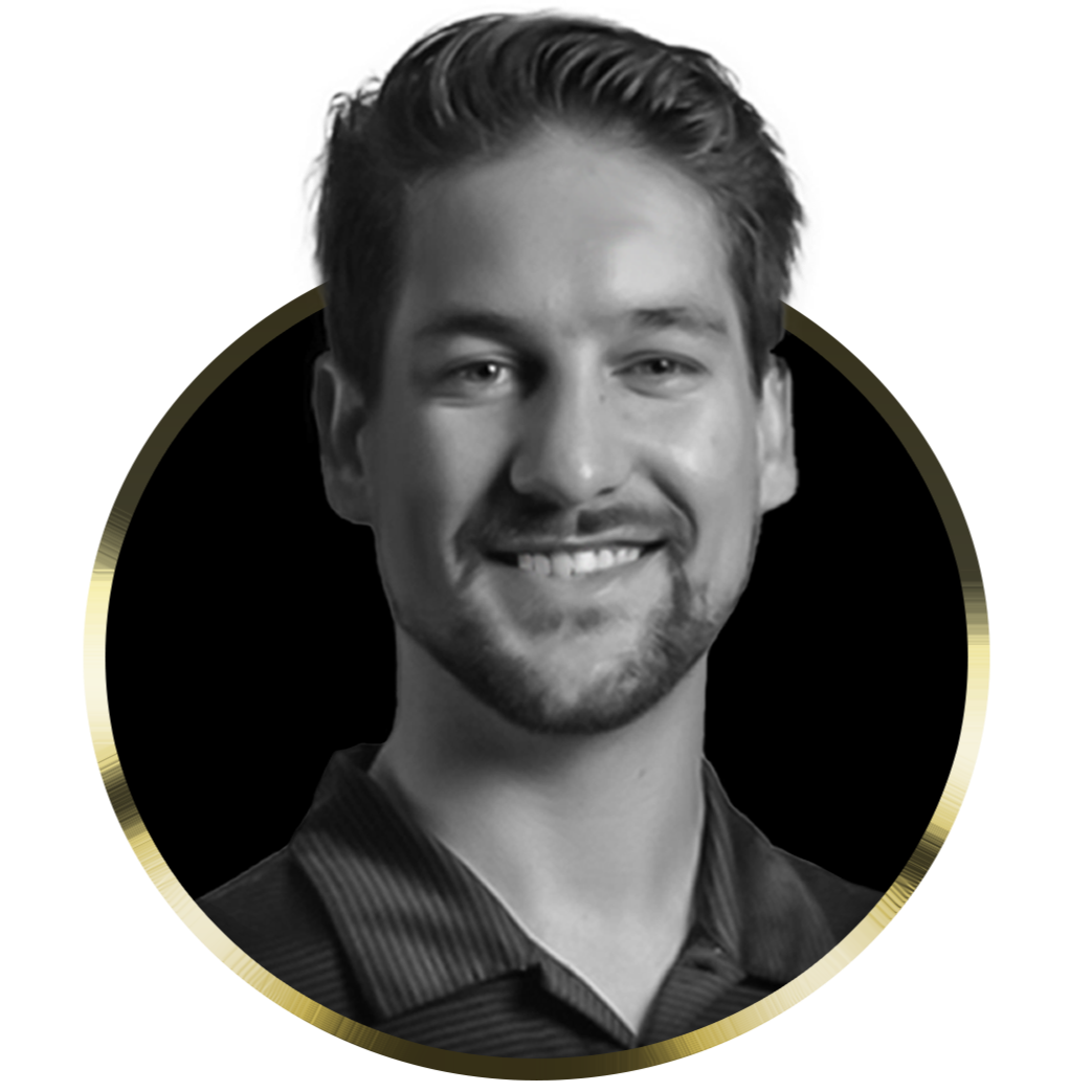 Black and white portrait of a smiling young man with styled hair and a goatee, wearing a collared shirt, positioned inside a circular gold border.