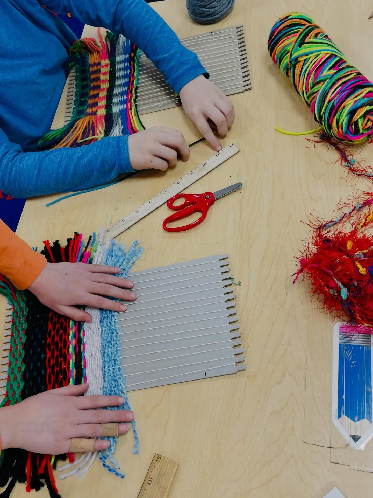 Second Grade students have been busy weaving!  They have been trying different weaving patterns and are also creating a second grade weaving on our large looms. #weaving #wiltonwayct #elementaryart