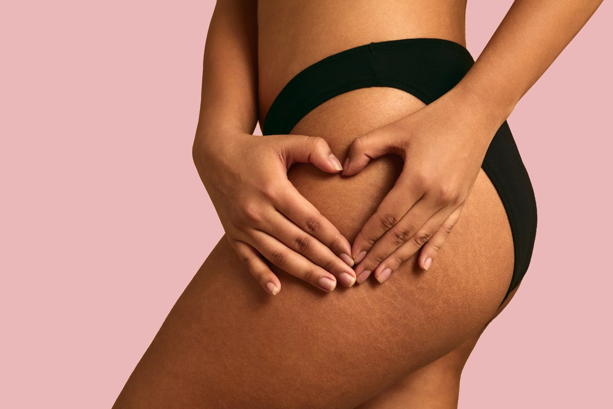 crop-plump-woman-showing-heart-gesture-on-body-2023-11-27-05-36-36-utc copy.jpg