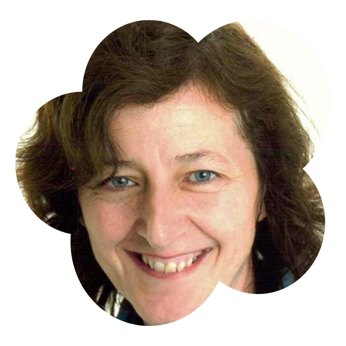 Close-up photo of a woman with curly brown hair, blue eyes, and a friendly smile.