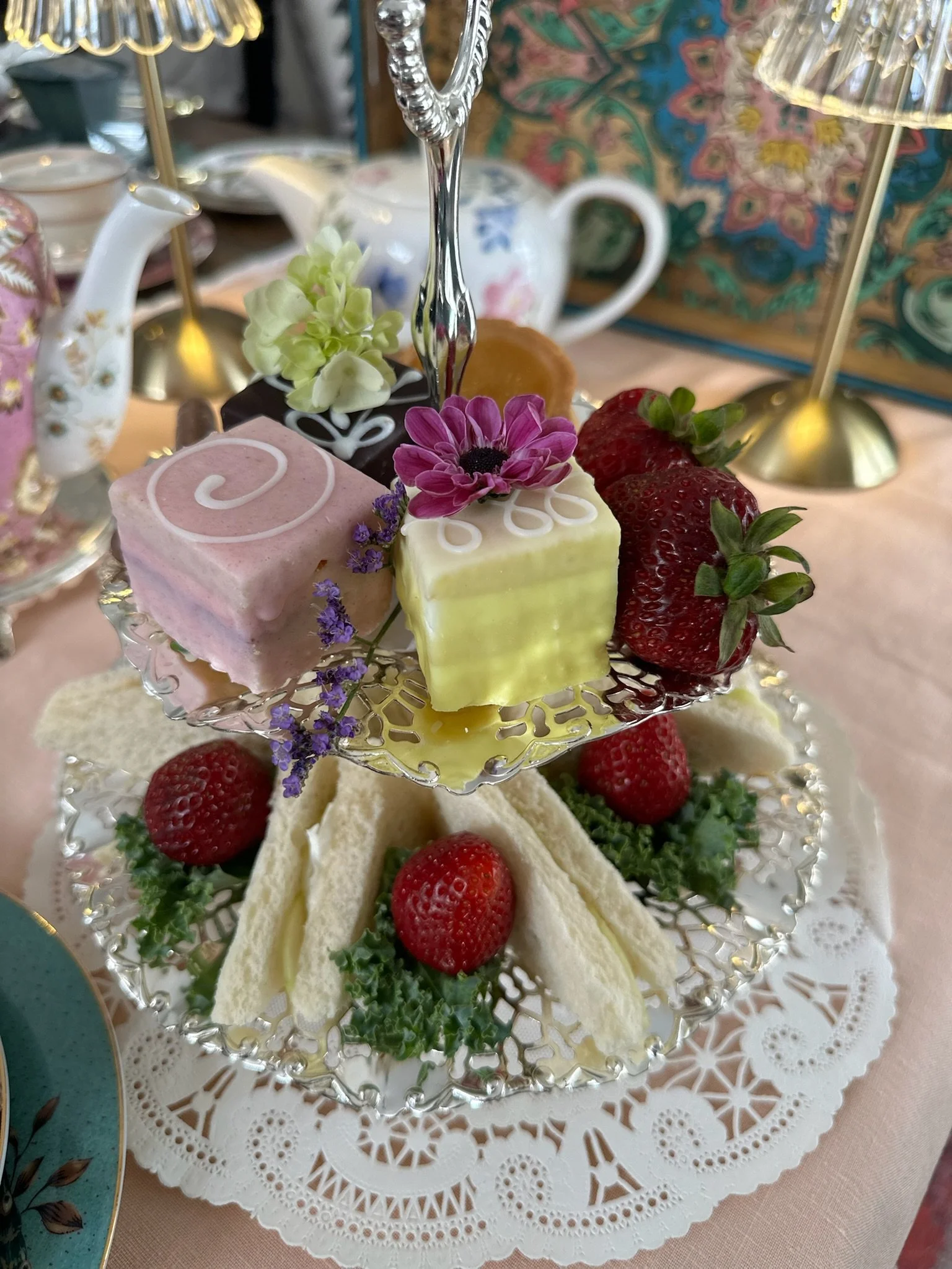 Tiered stand with tea sandwiches and sweet treats at afternoon tea in Monterey
