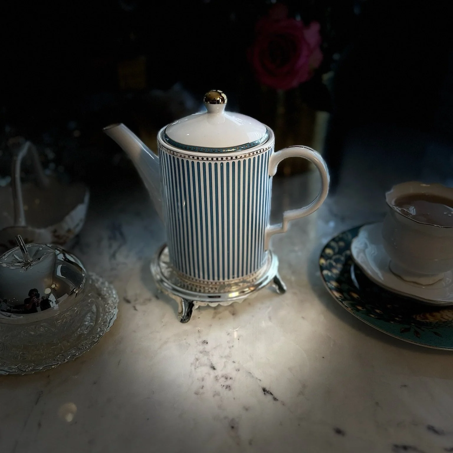 Afternoon tea service in Monterey showing table setup and tiered stands for frequently asked questions