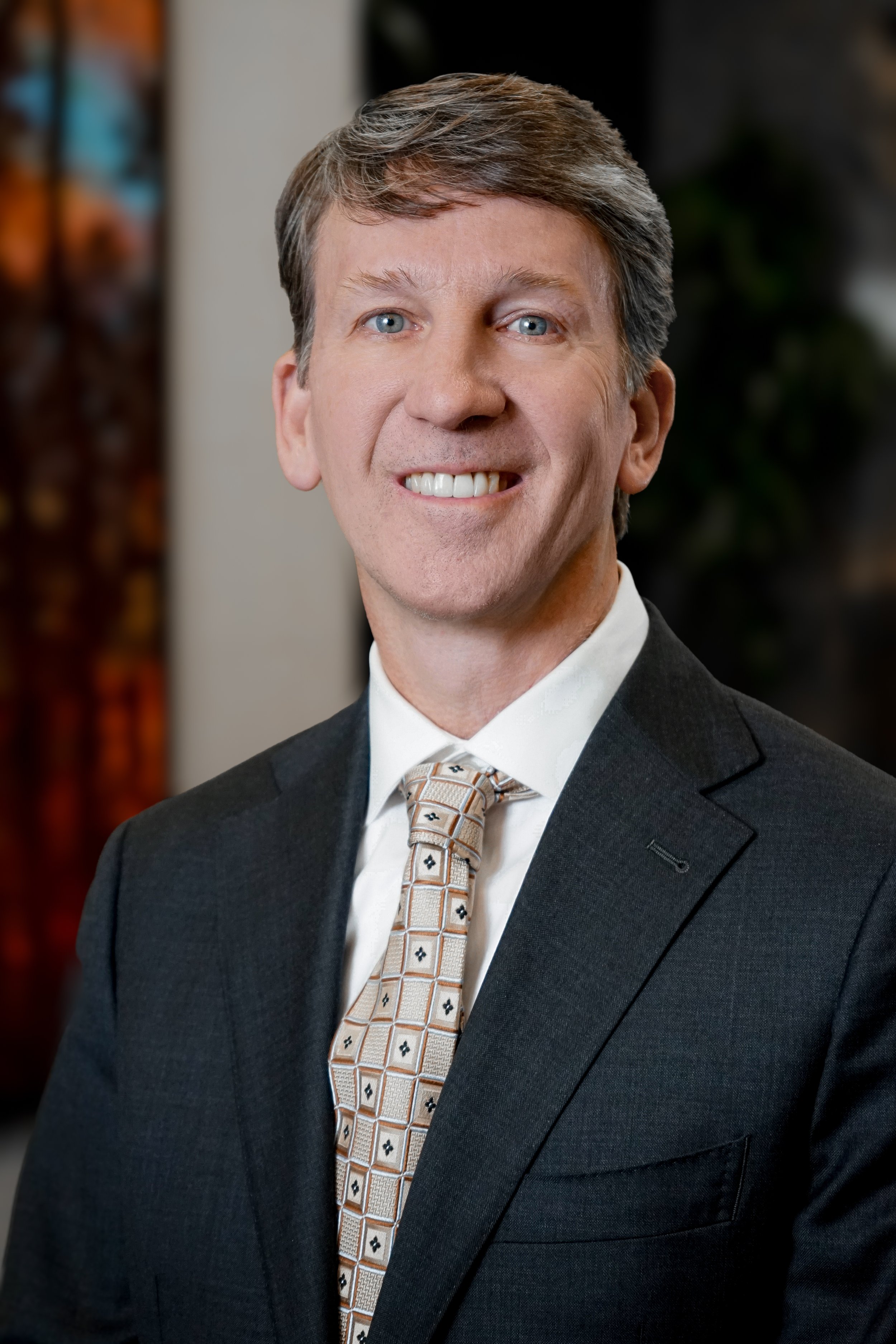 Businessman headshot with blurred background