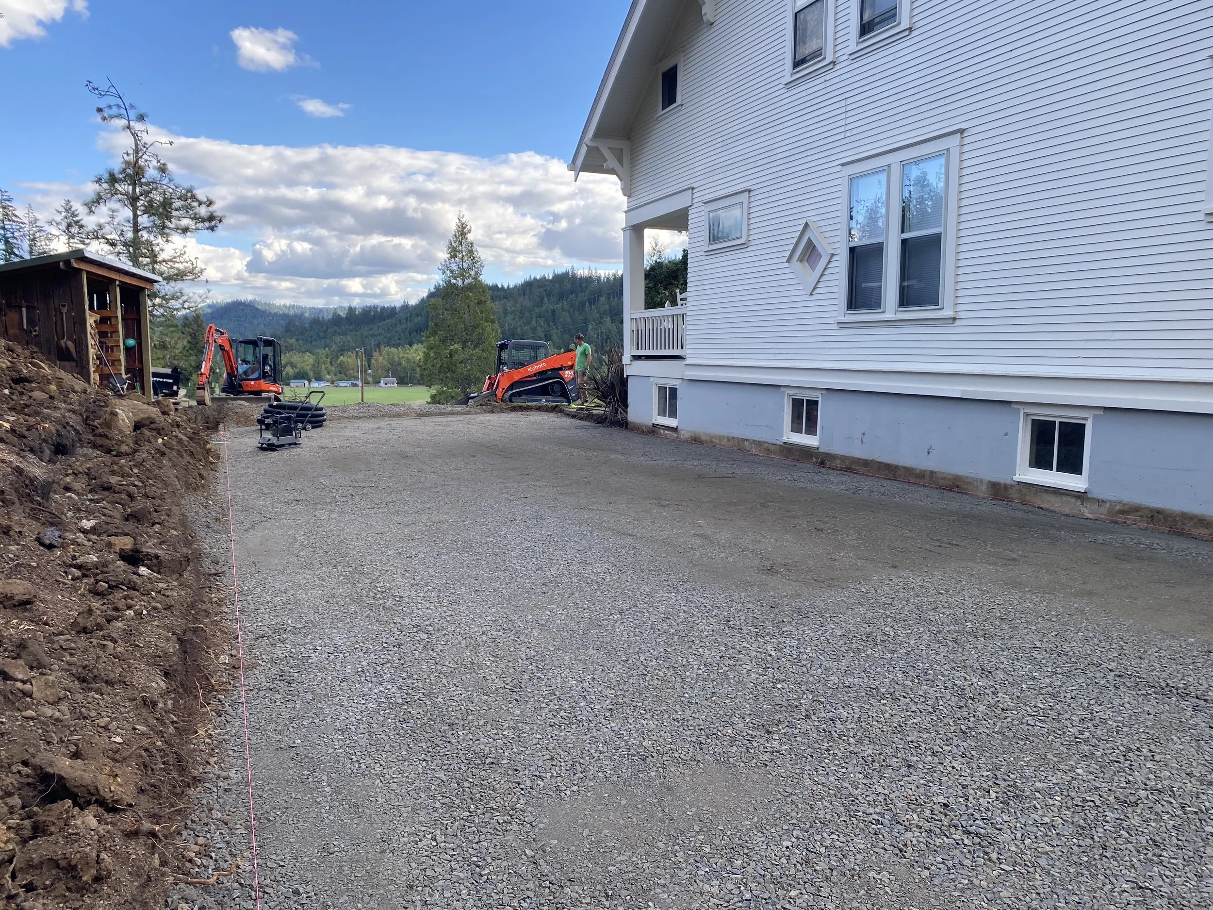 Base prepared and graded for proper installation of perforated drainage pipe.