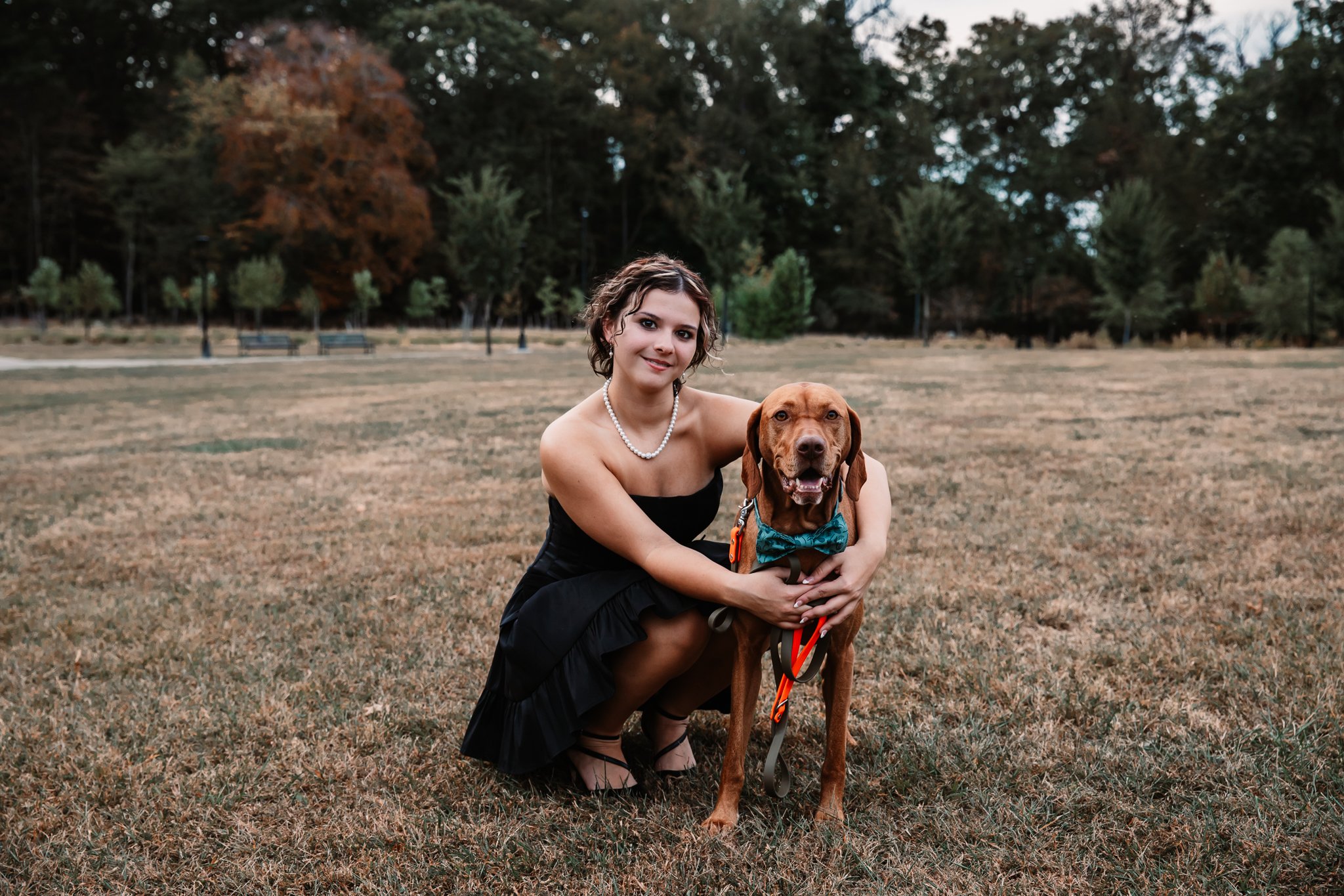 Senior girl and dog in open field Hartwood Acres