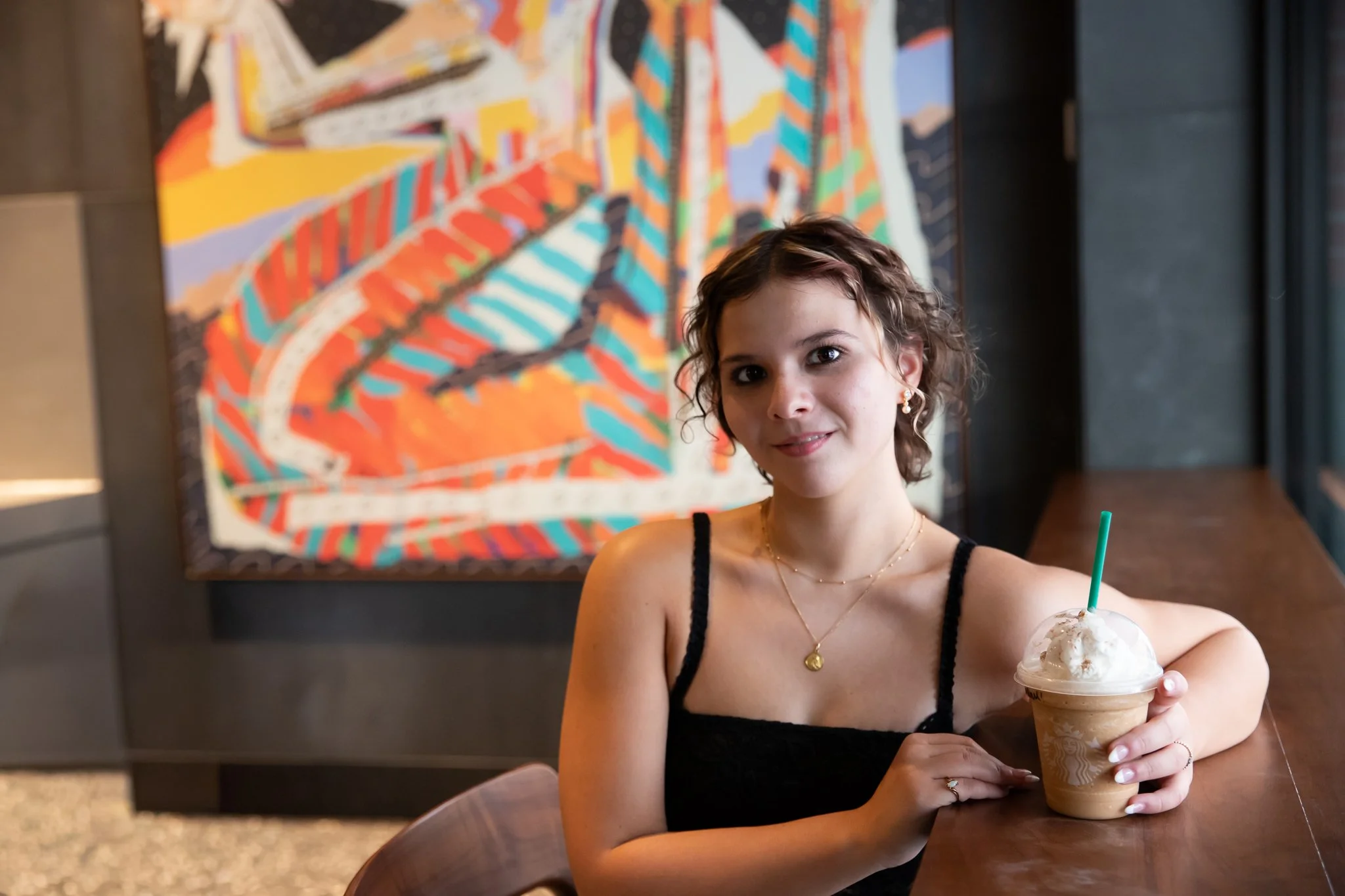 High school senior at Starbucks in the Strip District during her photo session in Pittsburgh PA